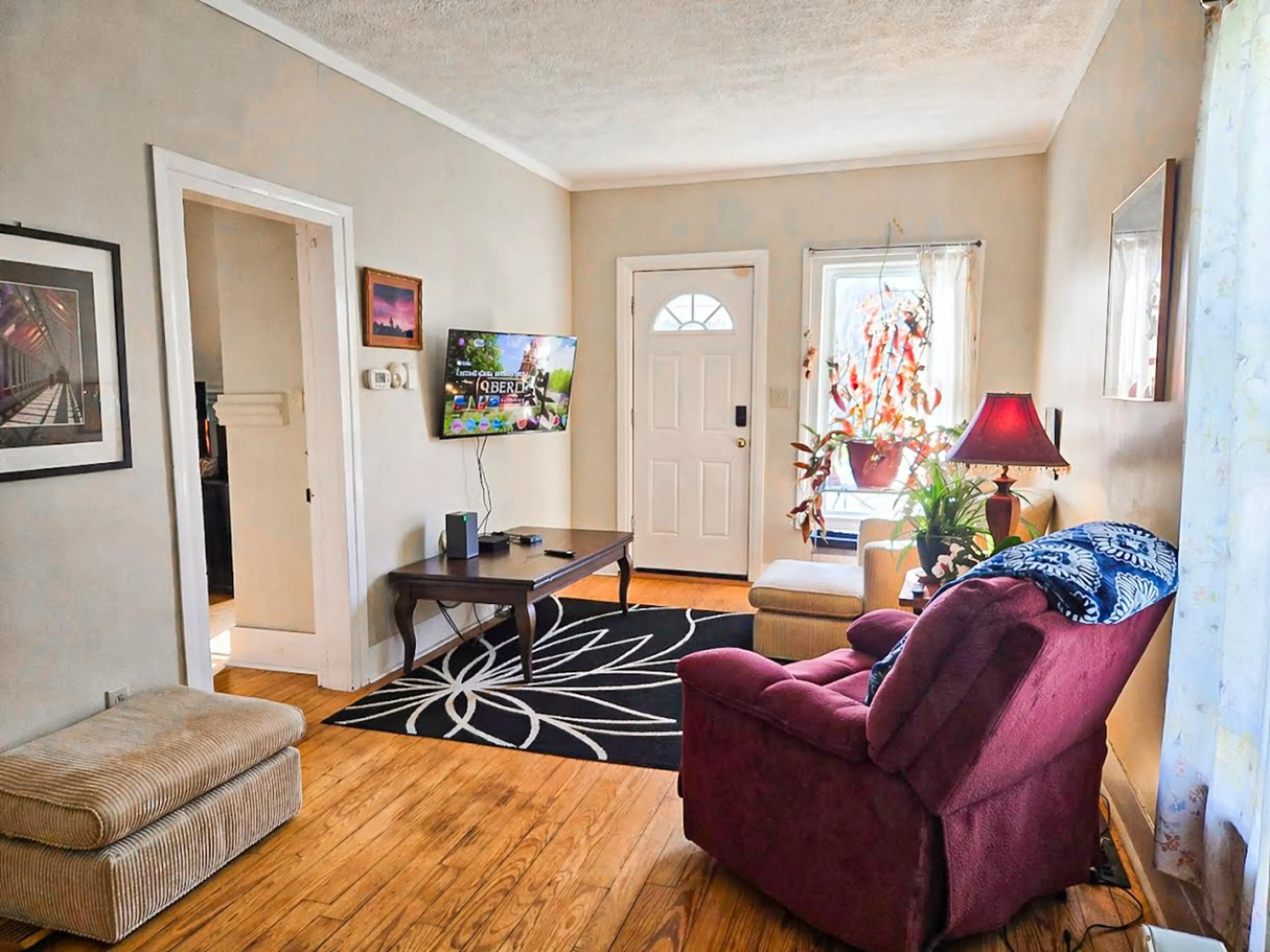 A living room with personality — bold textures, vintage comfort, and the kind of charm you can’t buy new.