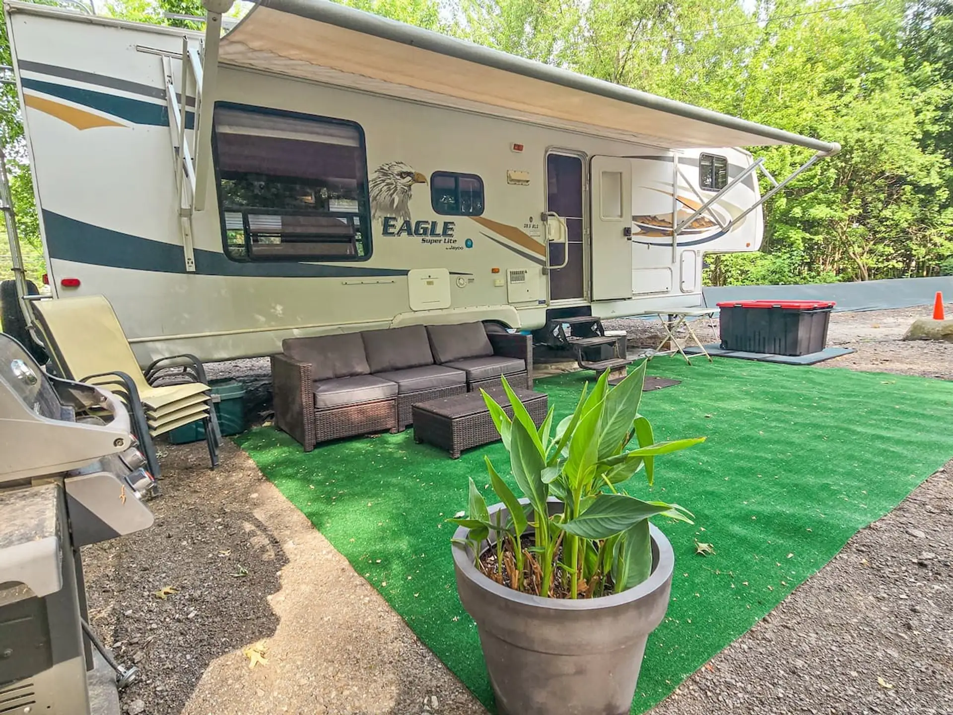 Your private wooded campsite includes outdoor seating, an awning.