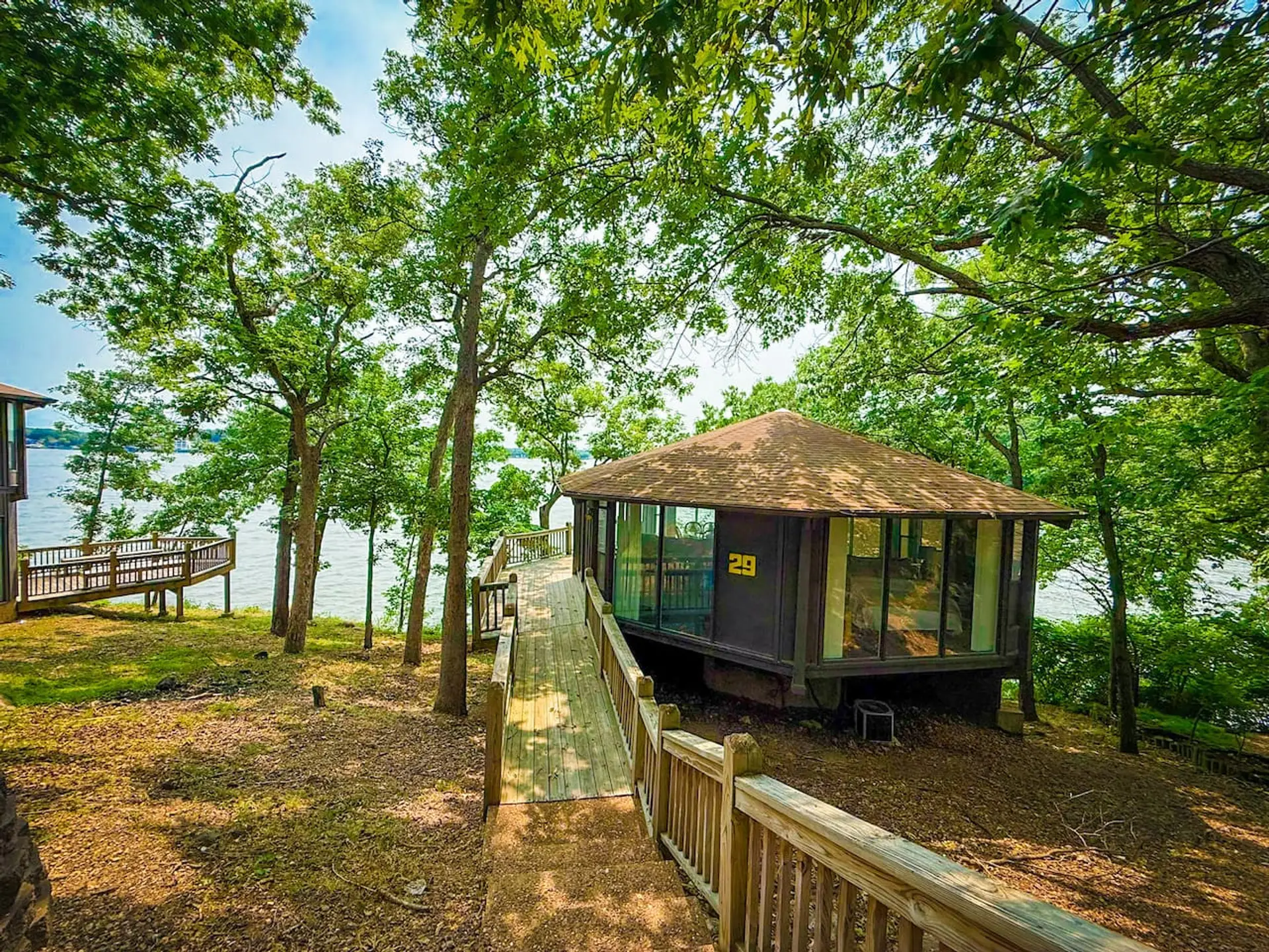Secluded lakefront villa with scenic boardwalks, wooded views, and peaceful waterfront access