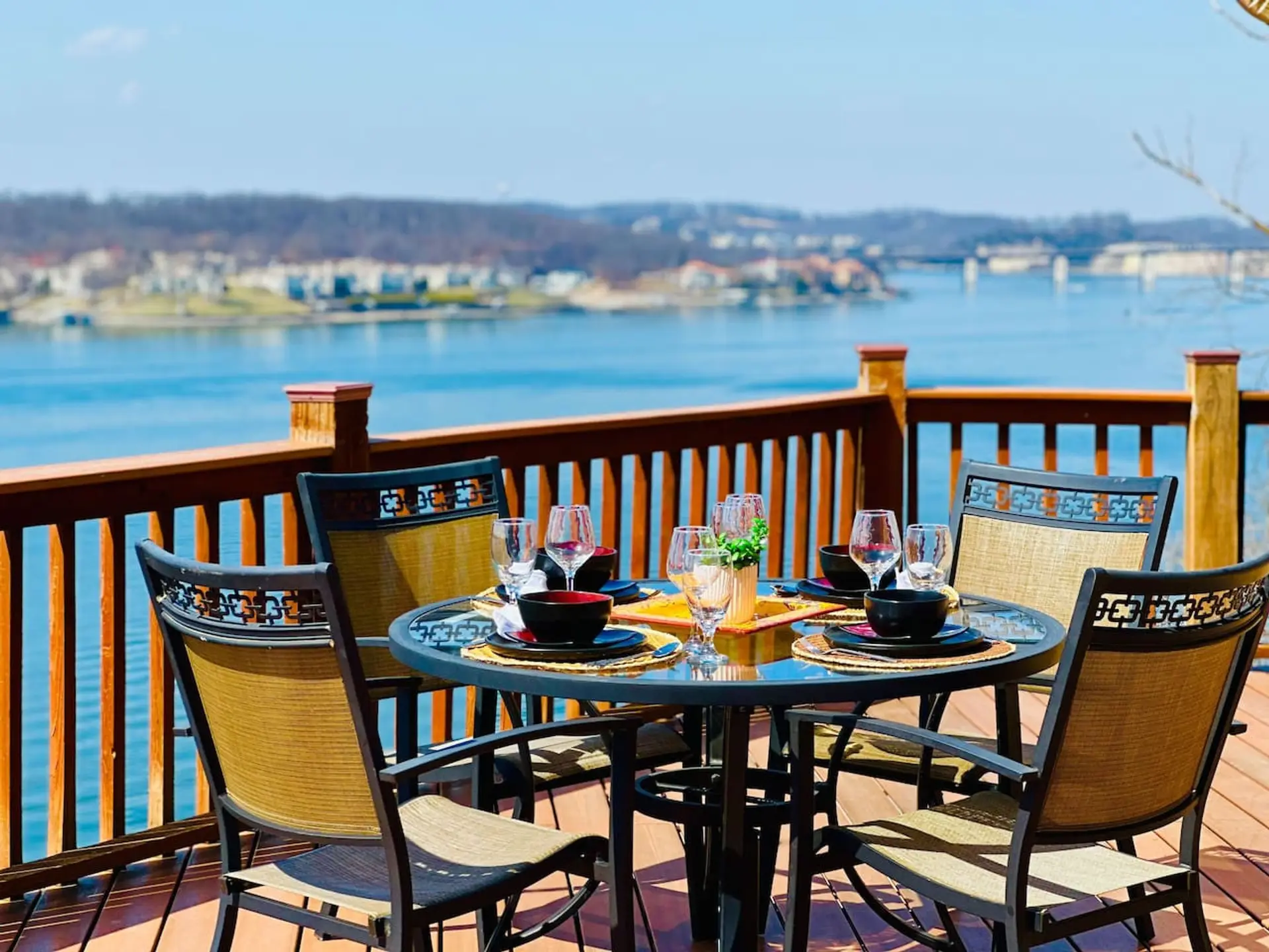 Enjoy morning coffee or evening sunsets on this expansive deck with stunning panoramic views of the lake. Perfect for outdoor dining and relaxation!