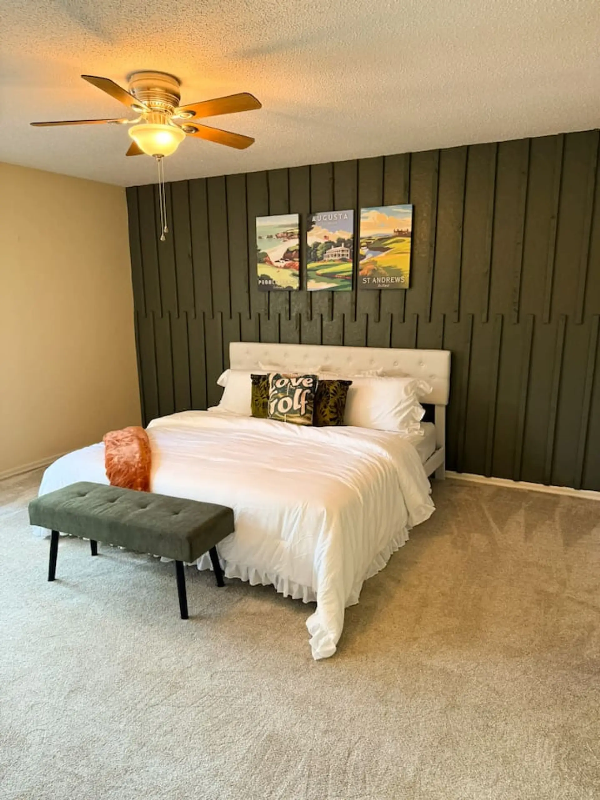 This inviting bedroom features a stylish accent wall, adding a touch of modern sophistication and visual interest. The spacious layout accommodates a queen-sized bed and offers a serene retreat with ample natural light, creating a comfortable and pri
