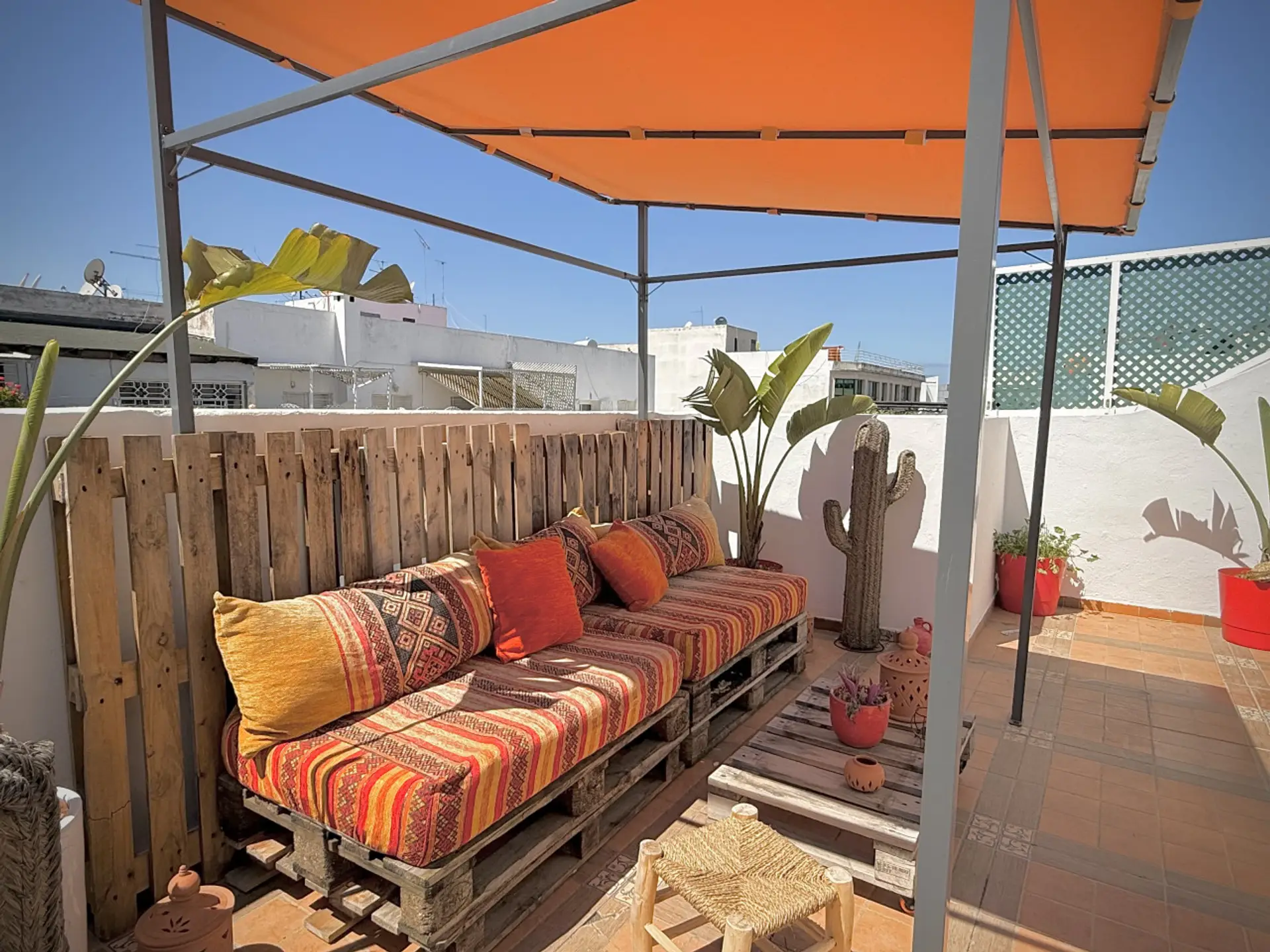 Sunny terrace with outdoor seating area