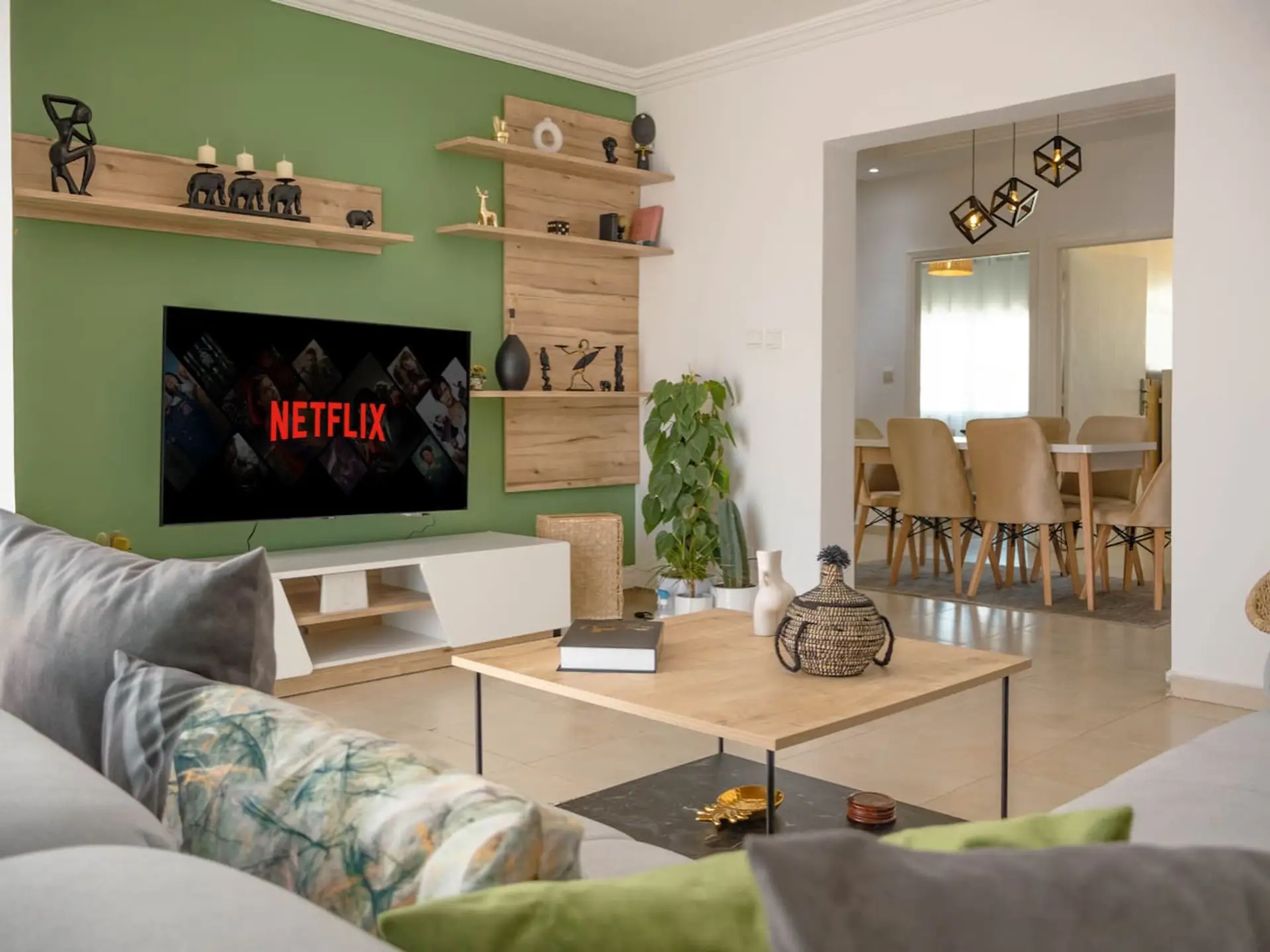 Bright living room with TV and comfortable seating
