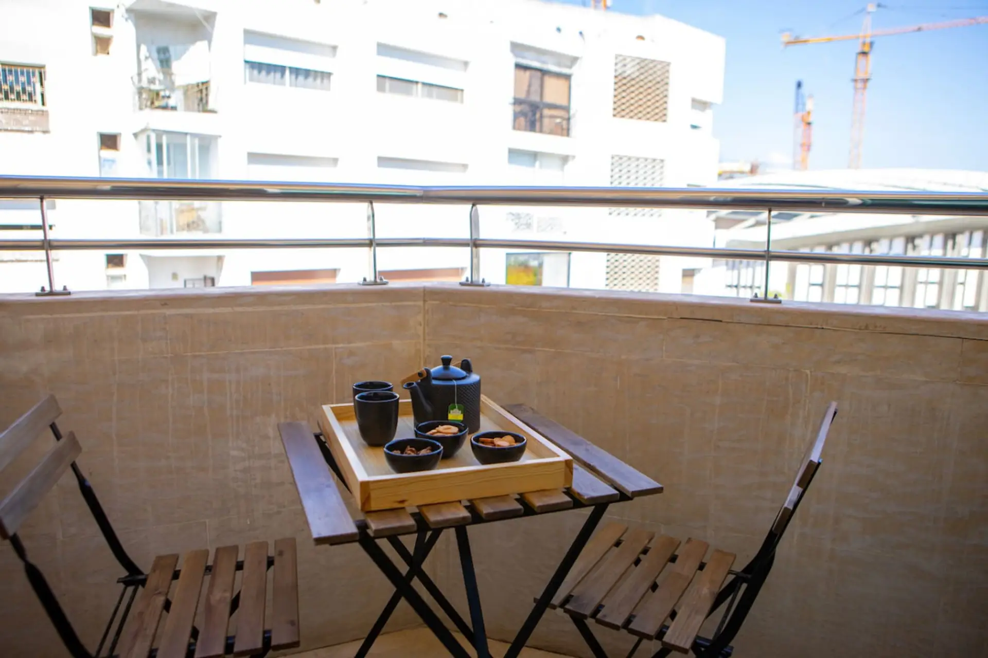 Cozy balcony with table, perfect for breakfast or relaxing outdoors