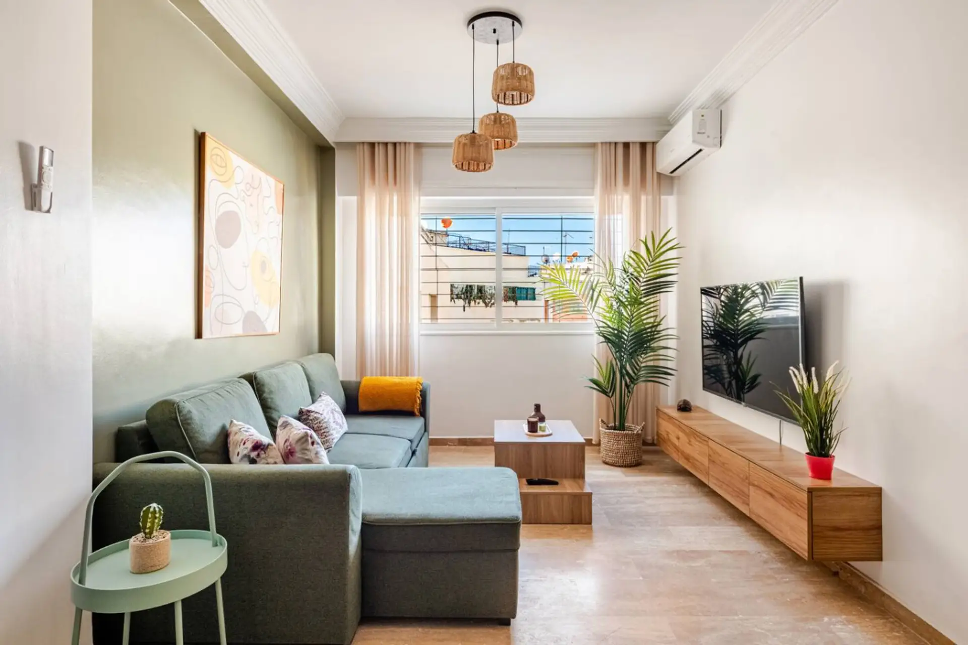 Bright living room with sofa and TV