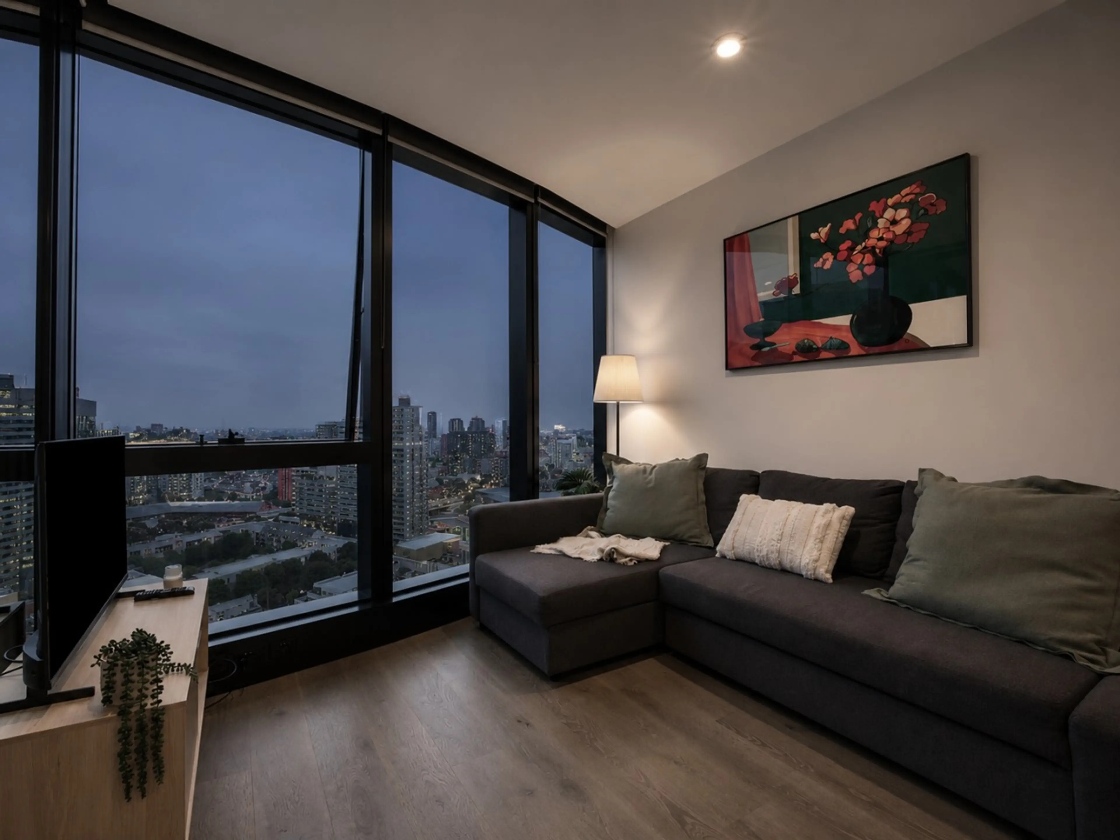 The living room sits beside a winter garden and is equipped with a smart TV and a sofa bed (setup available on request).