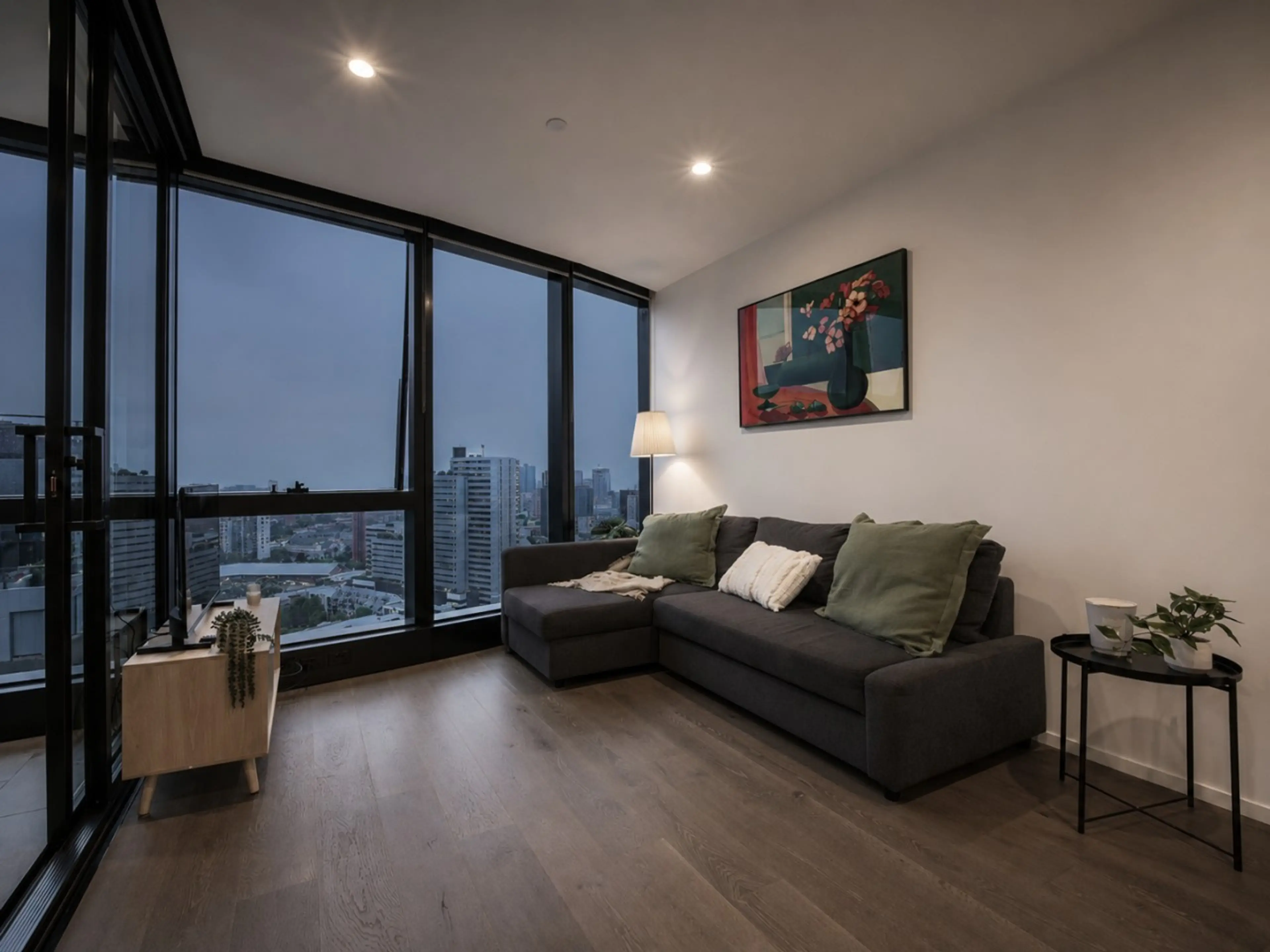 The living room sits beside a winter garden and is equipped with a smart TV and a sofa bed (setup available on request).