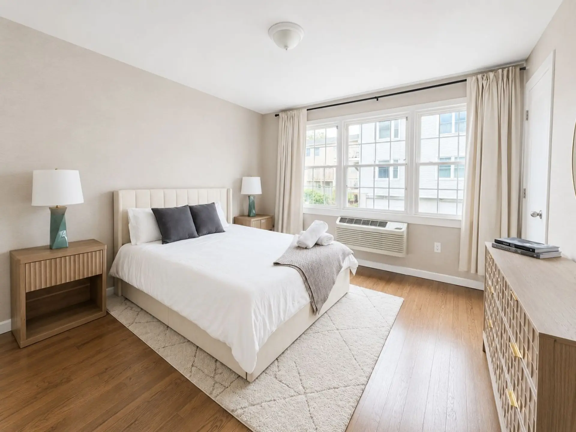 Second bedroom with a queen bed and natural light.