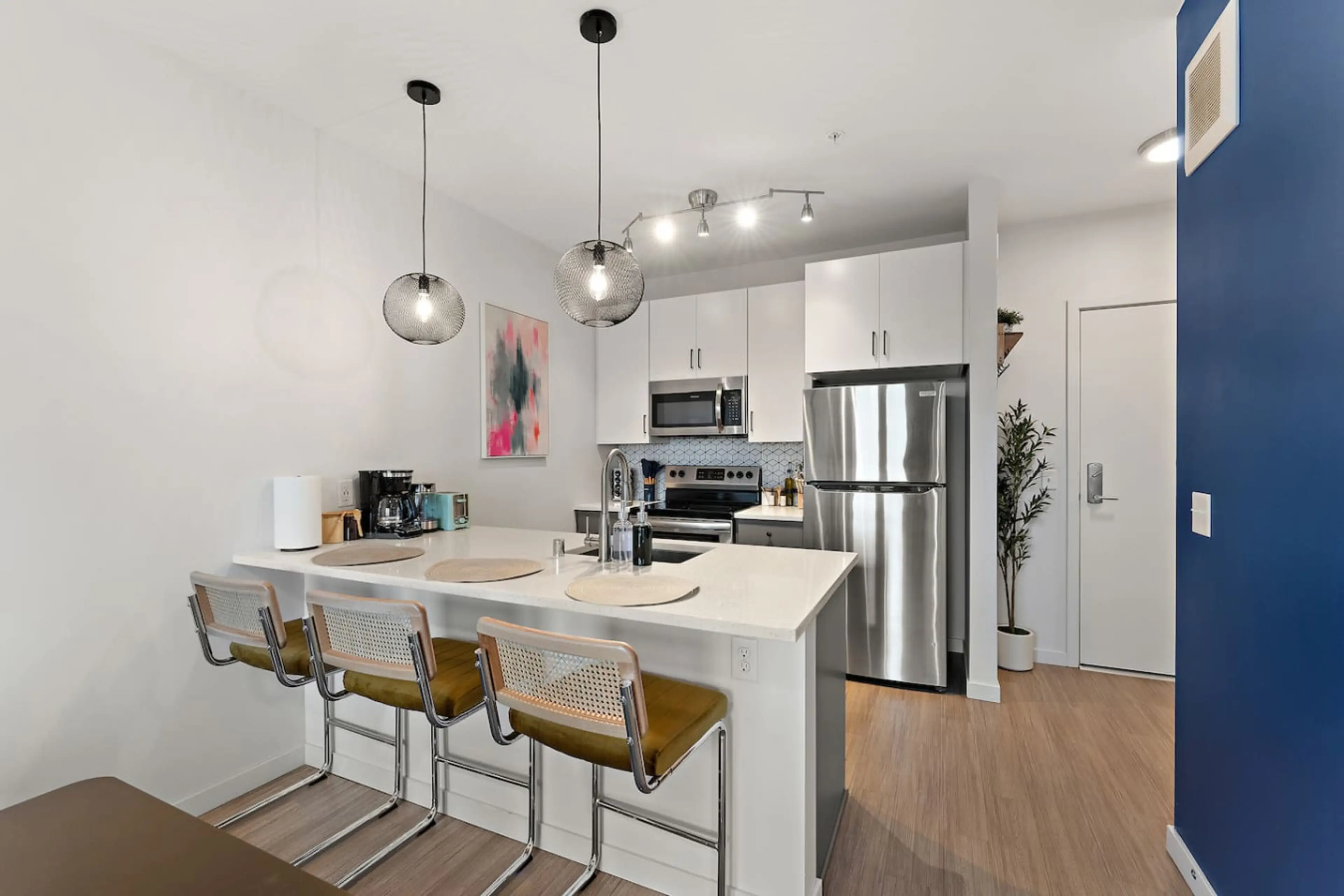 Modern design and sleek appliances create a vibrant setting for delicious meals!