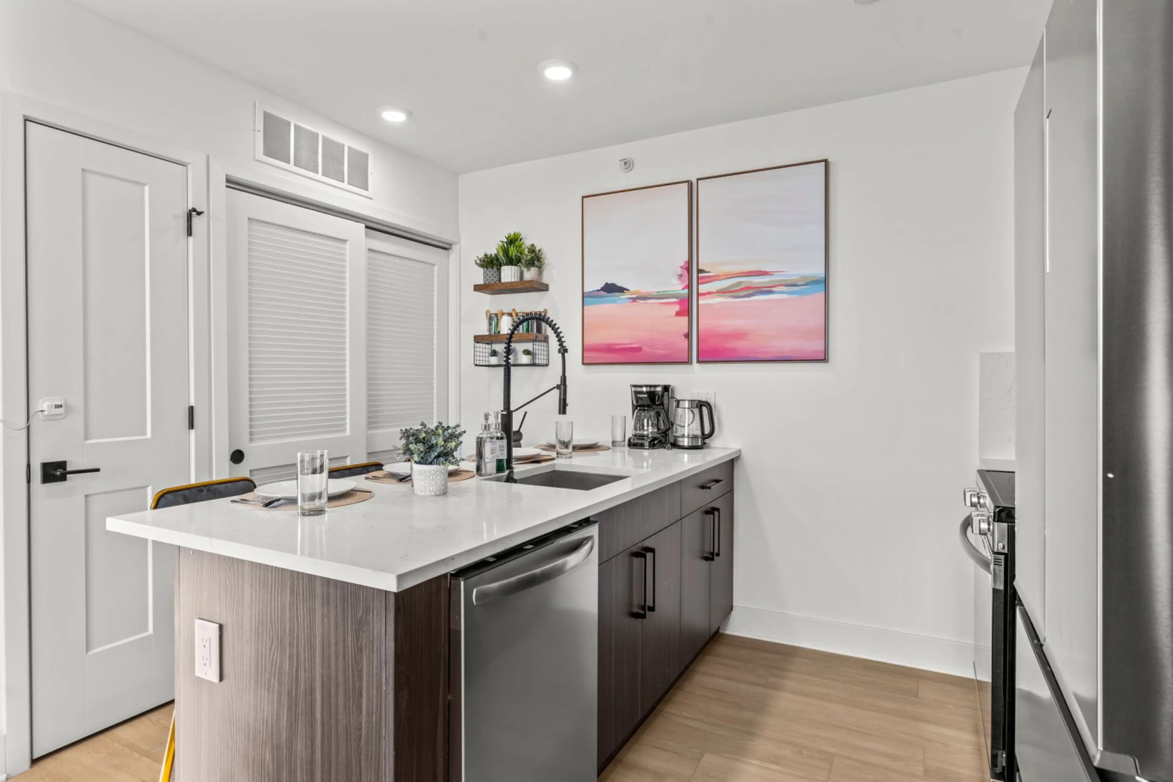 Create home-cooked meals in this stylish kitchen with modern appliances and vibrant décor.