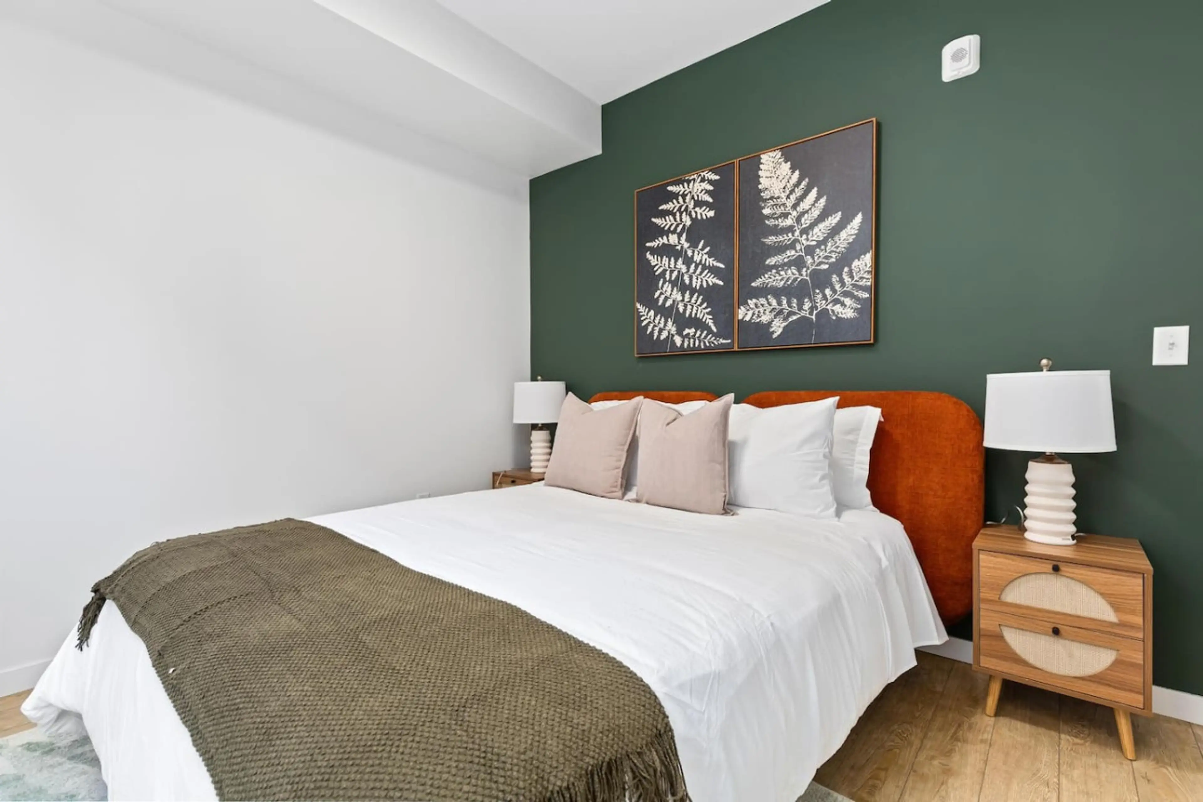 Bedroom Retreat: Stylish design with a plush bed, vibrant accents, and serene decor awaits you!