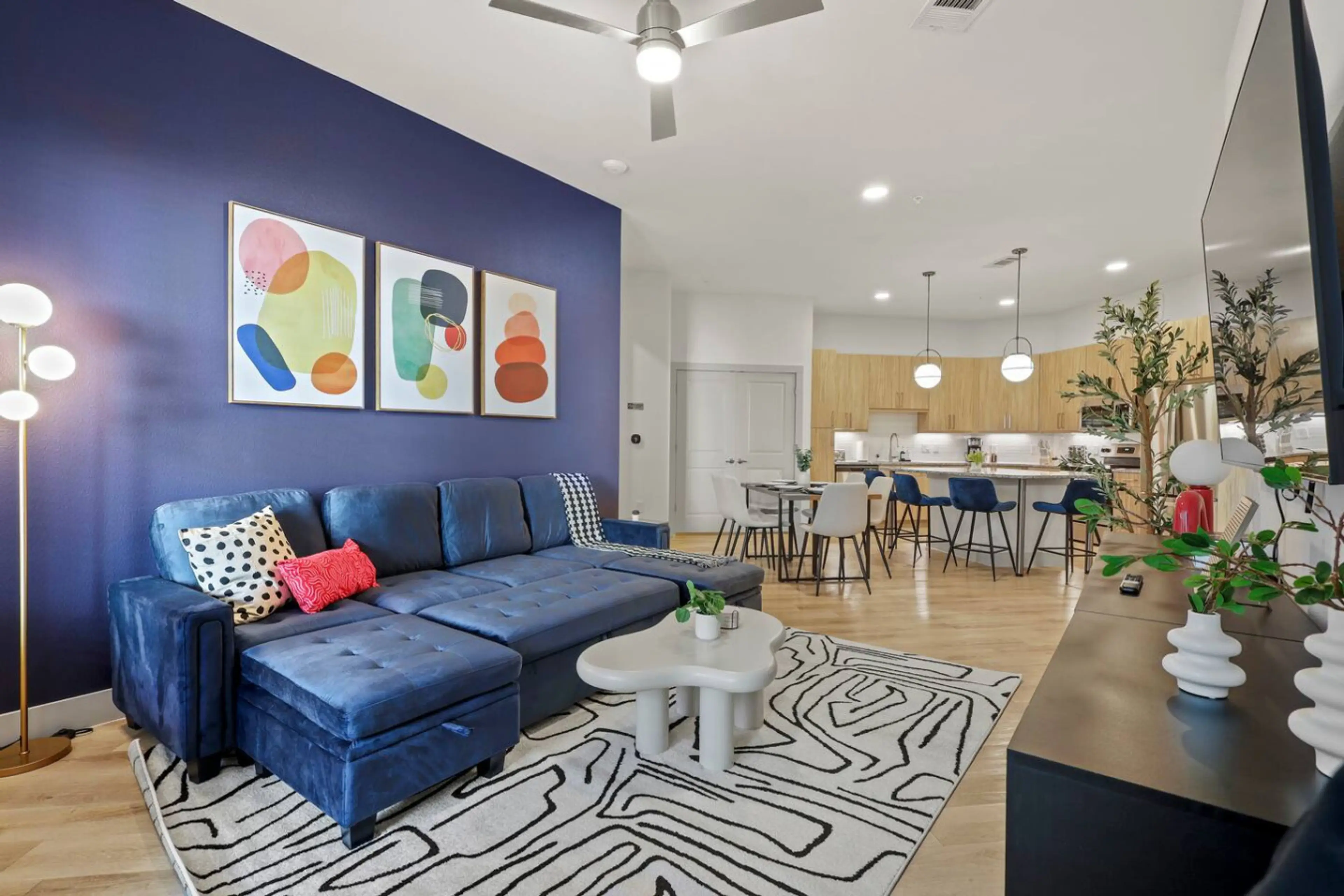 Living Room: Vibrant hues meet sleek style, perfect for gatherings and relaxing with flair!