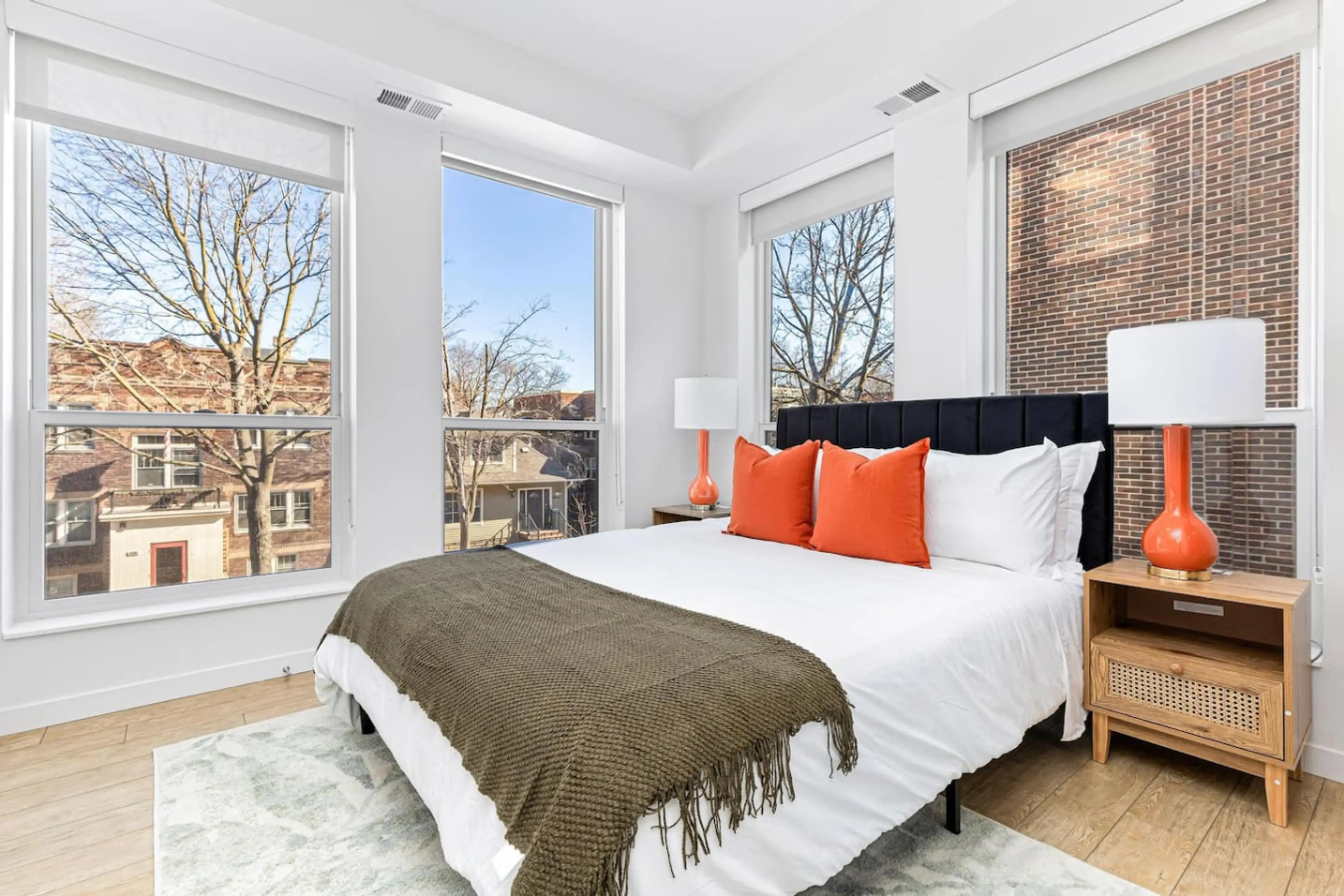 Bright & Inviting Bedroom: Bask in sunlight, stylish decor, and vibrant hues for a delightful stay!