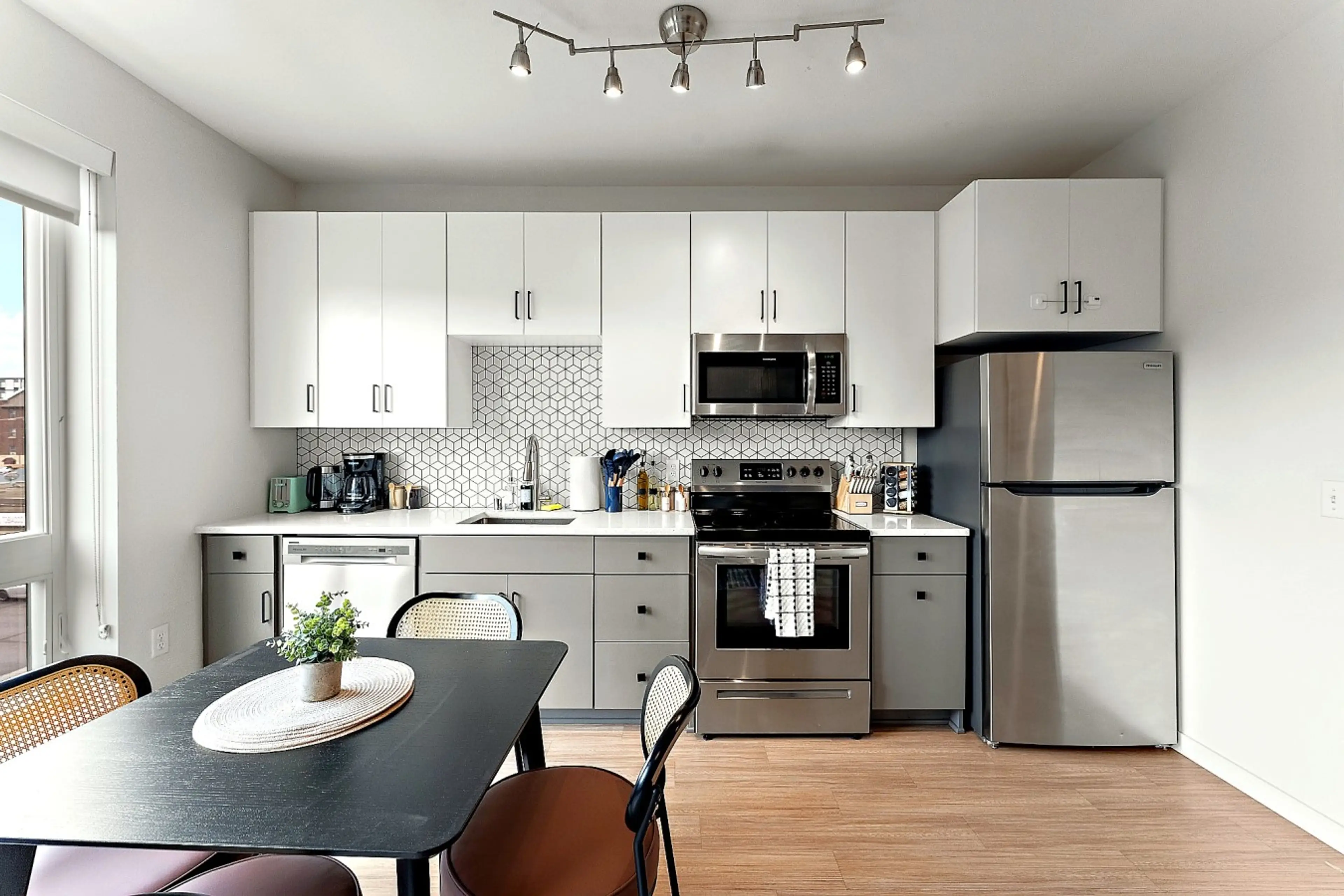A bright, fully equipped kitchen with modern appliances, cookware, and essentials for a convenient stay.