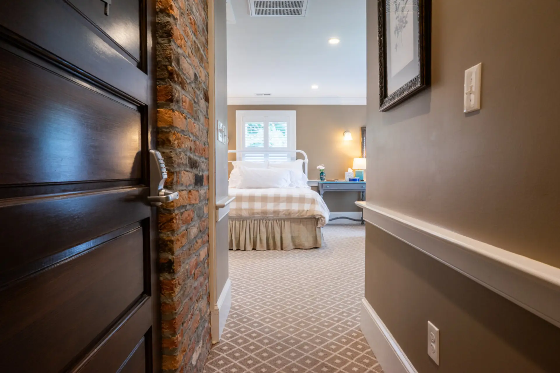 A welcoming entry leads into a serene retreat with thoughtful details and warm tones.