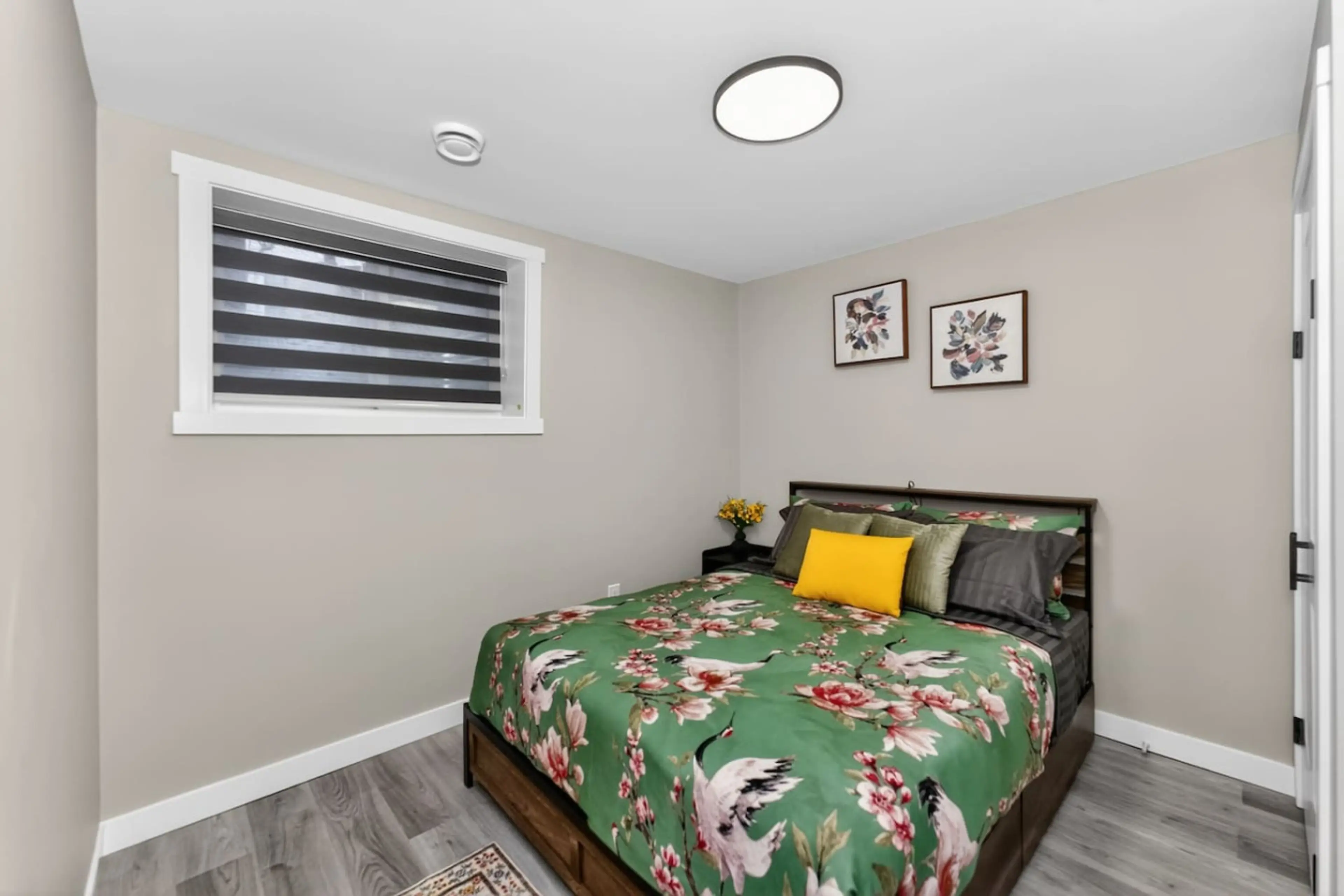 Comfortable bedroom with clean linens and natural light