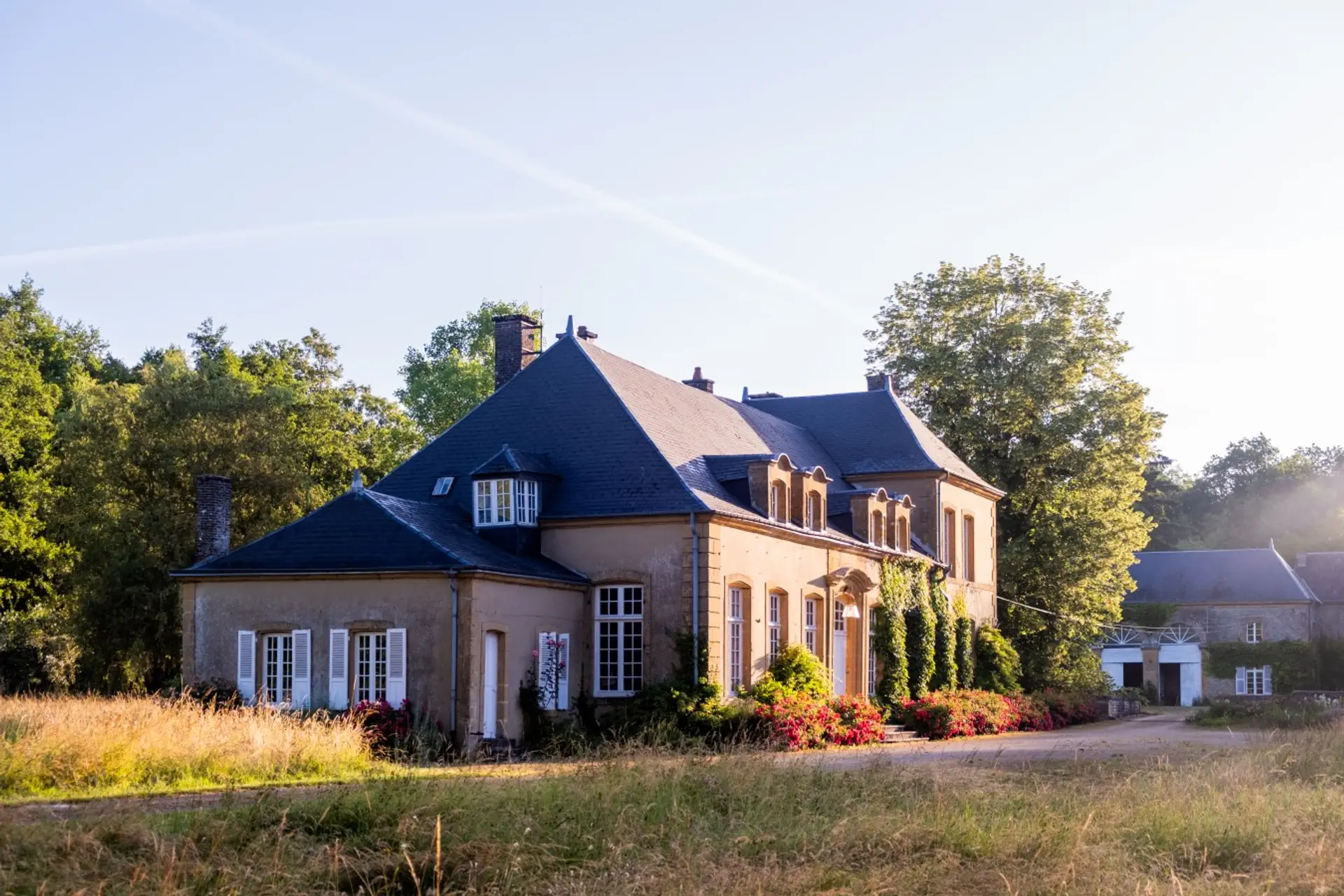 A historic estate surrounded by woodland, meadows and flowing water in the French Ardennes.
