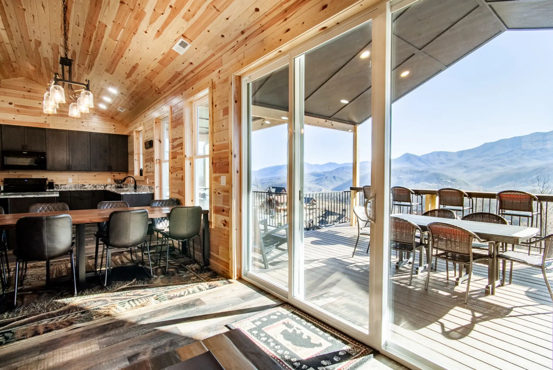 Spacious cabin with stunning views, modern kitchen, and patio.