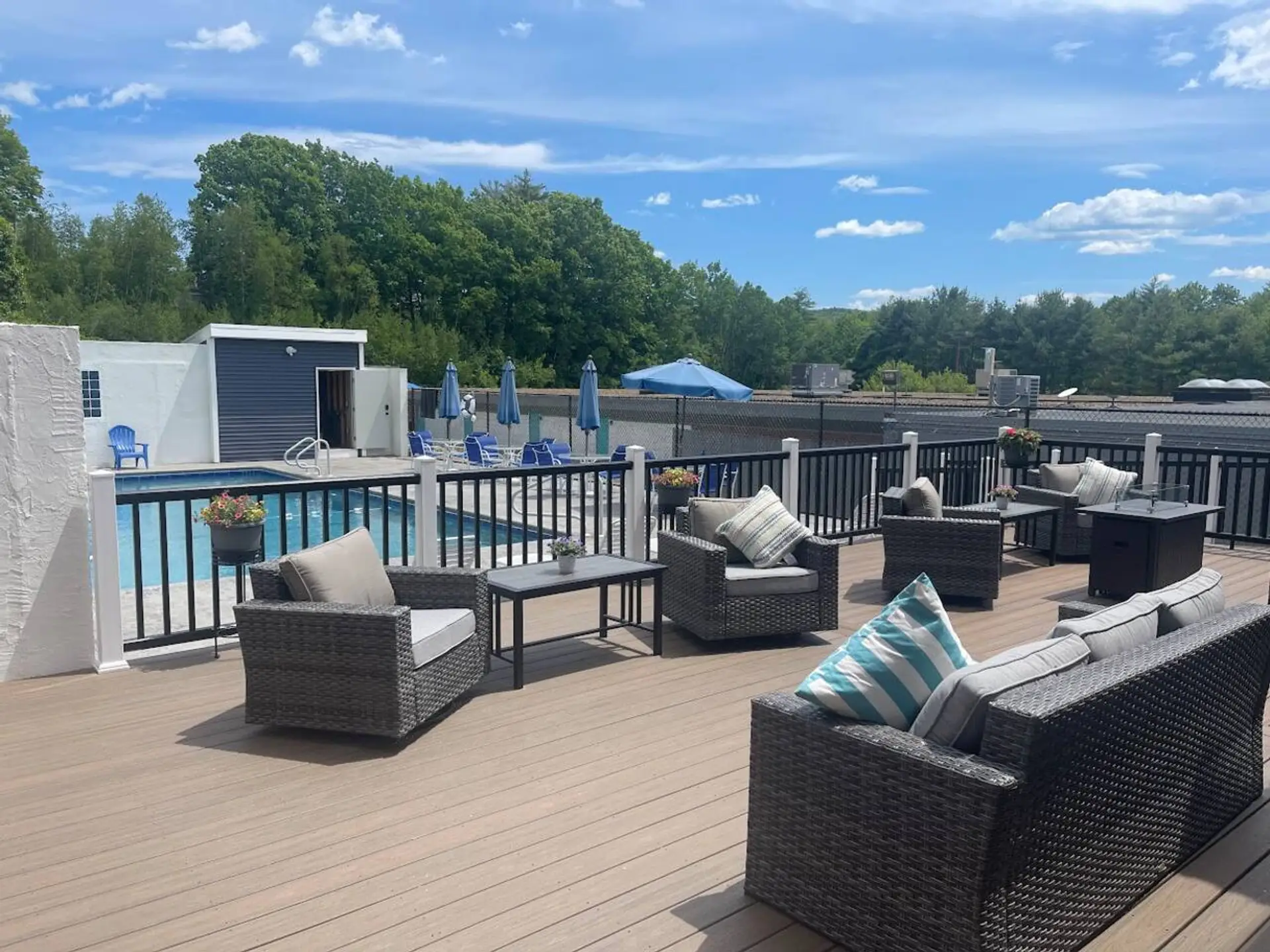 pool with 2 BBQ grills and two firepits