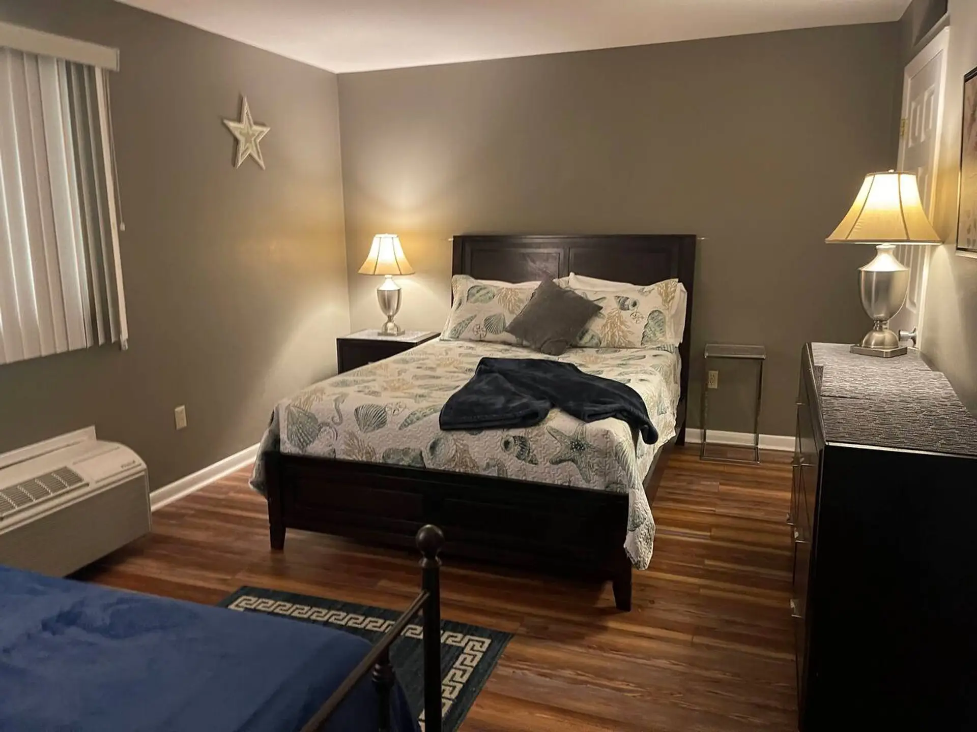 Bedroom #1 with a queen bed and two twins
