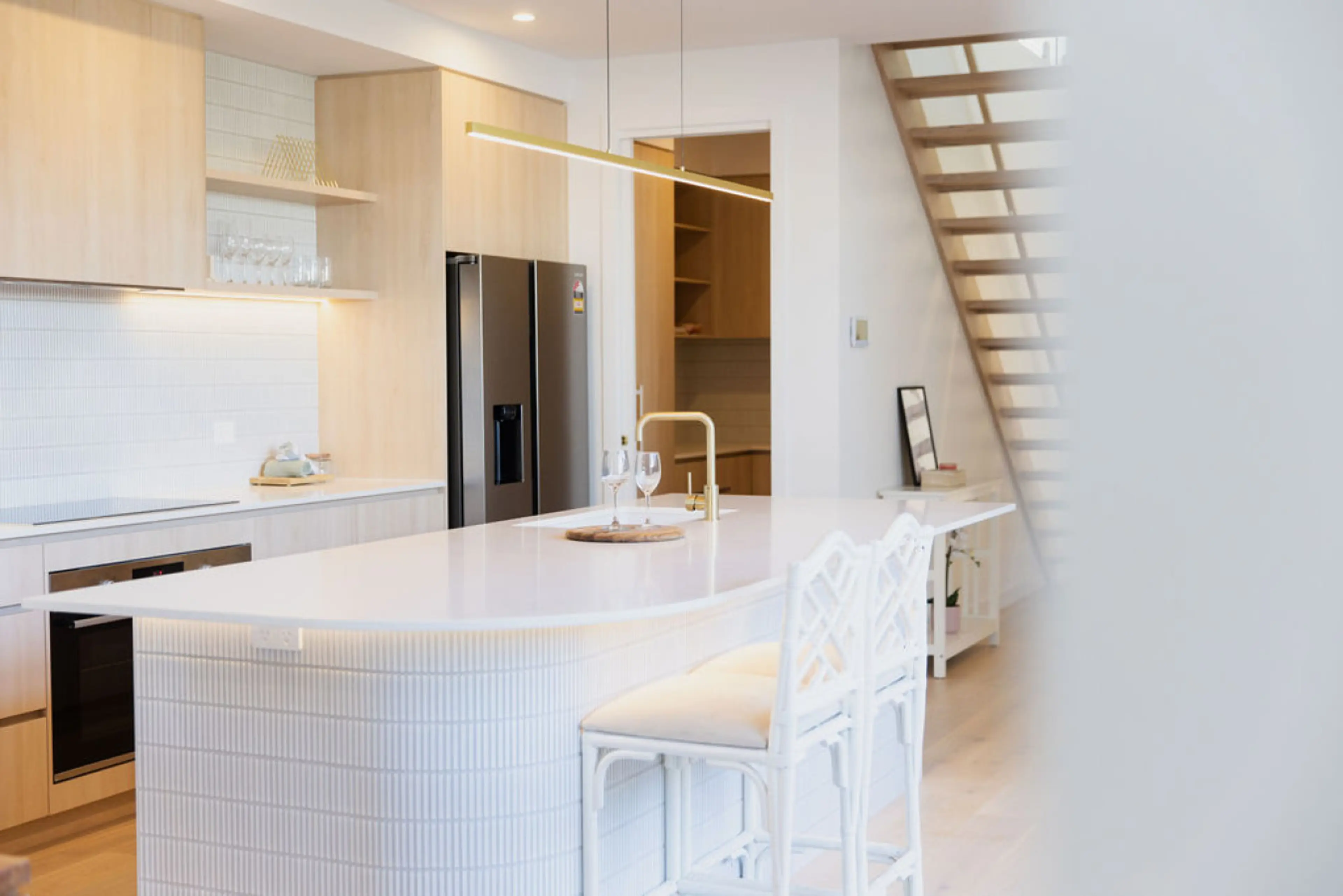 Modern kitchen with sleek island and light finishes, bright and effortlessly stylish