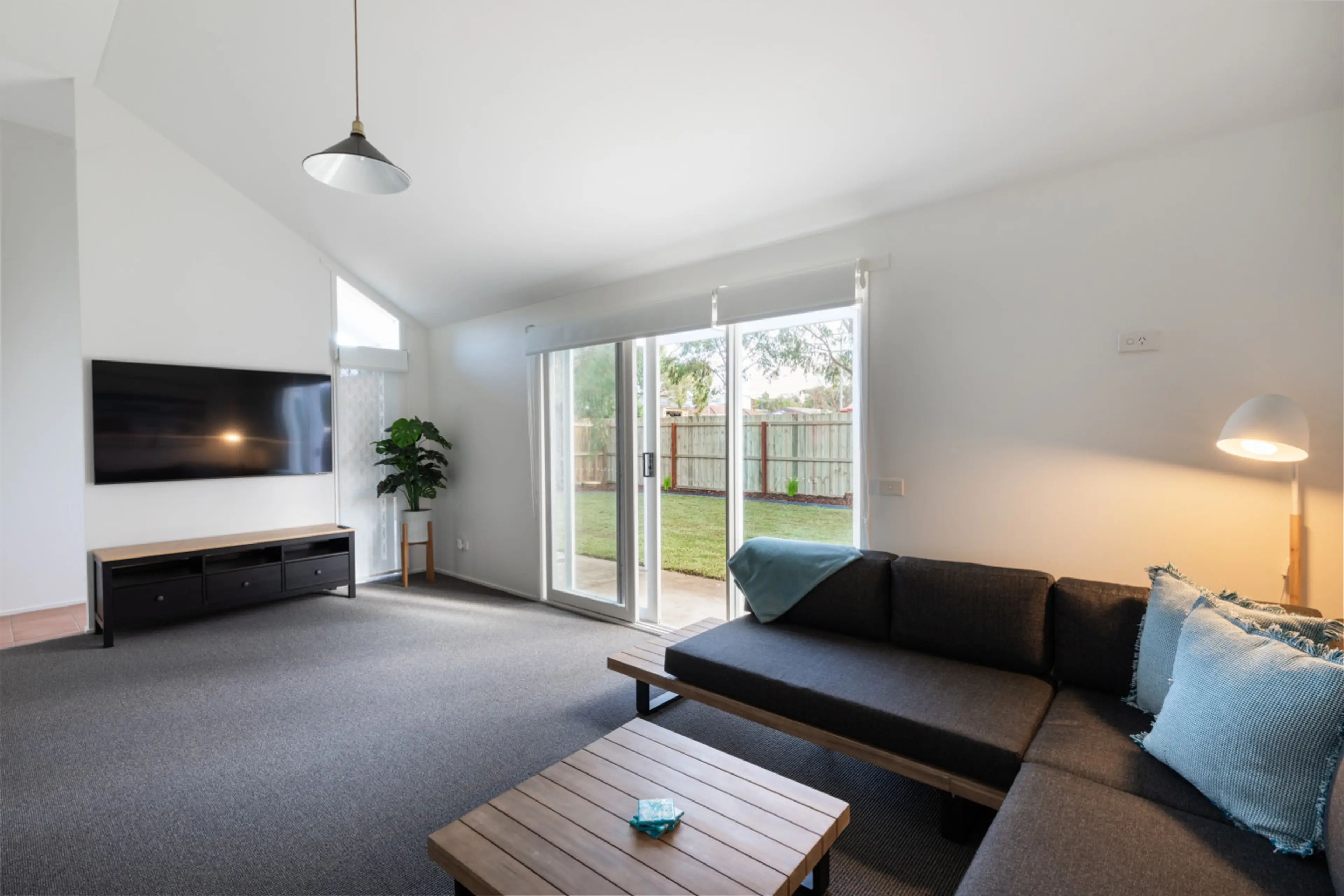 Bright living room with cozy seating and garden access