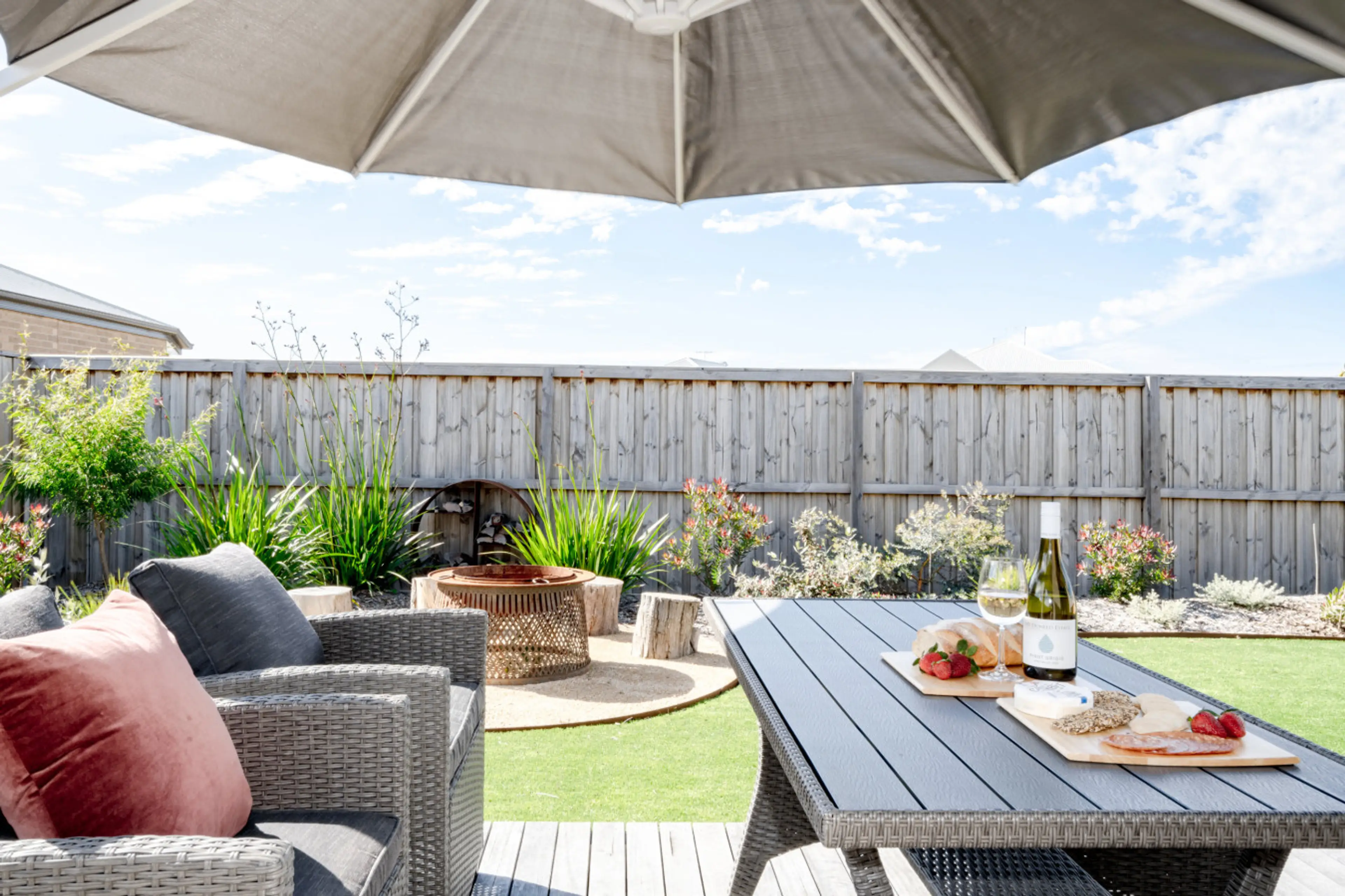 Relaxed outdoor setting perfect for dining, lounging, and enjoying the garden.