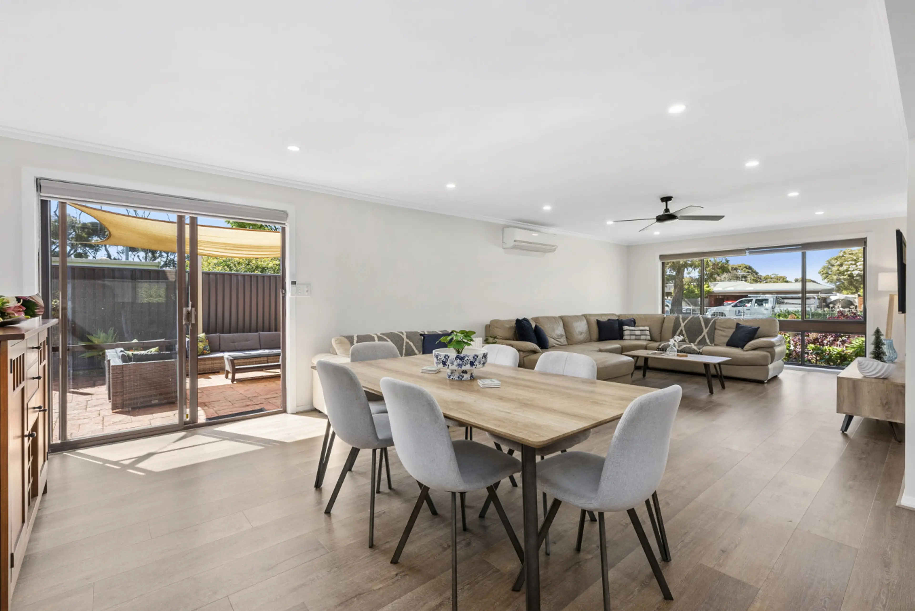 A bright open space that brings everyone together—dine, relax, and step straight out to the patio.