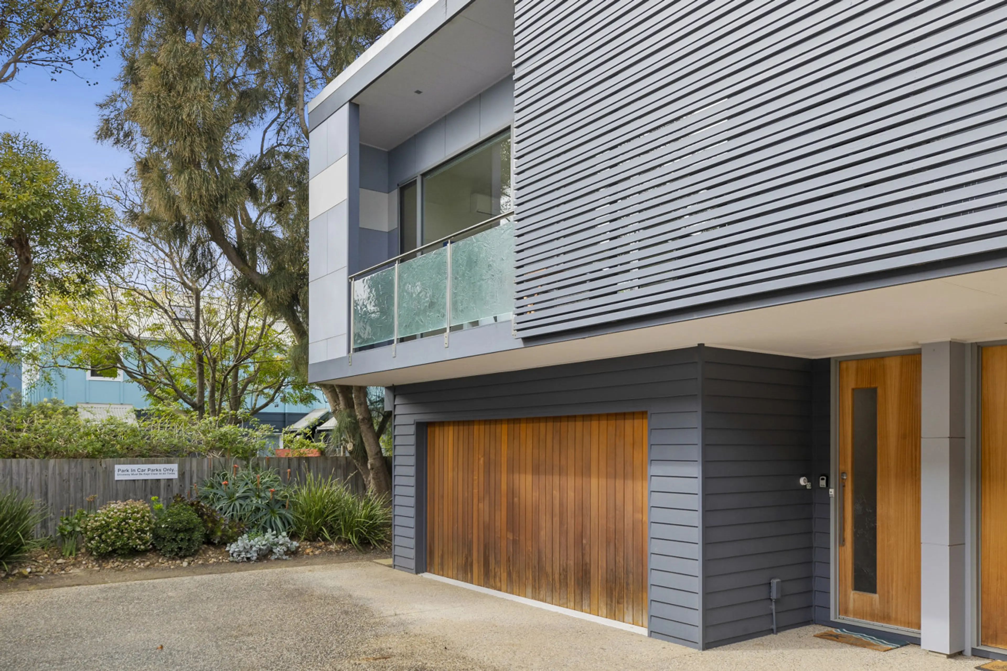 Modern exterior with a clean facade and private entrance.
