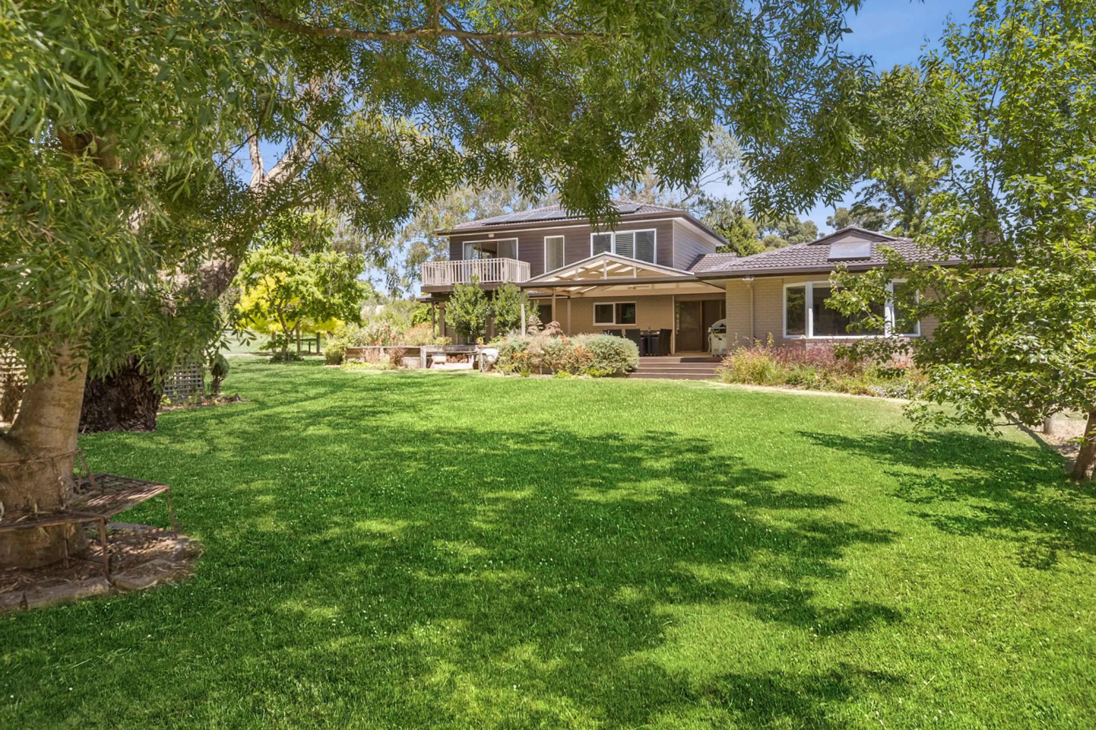 A garden entrance that sets the tone — lush, private, and full of character.
