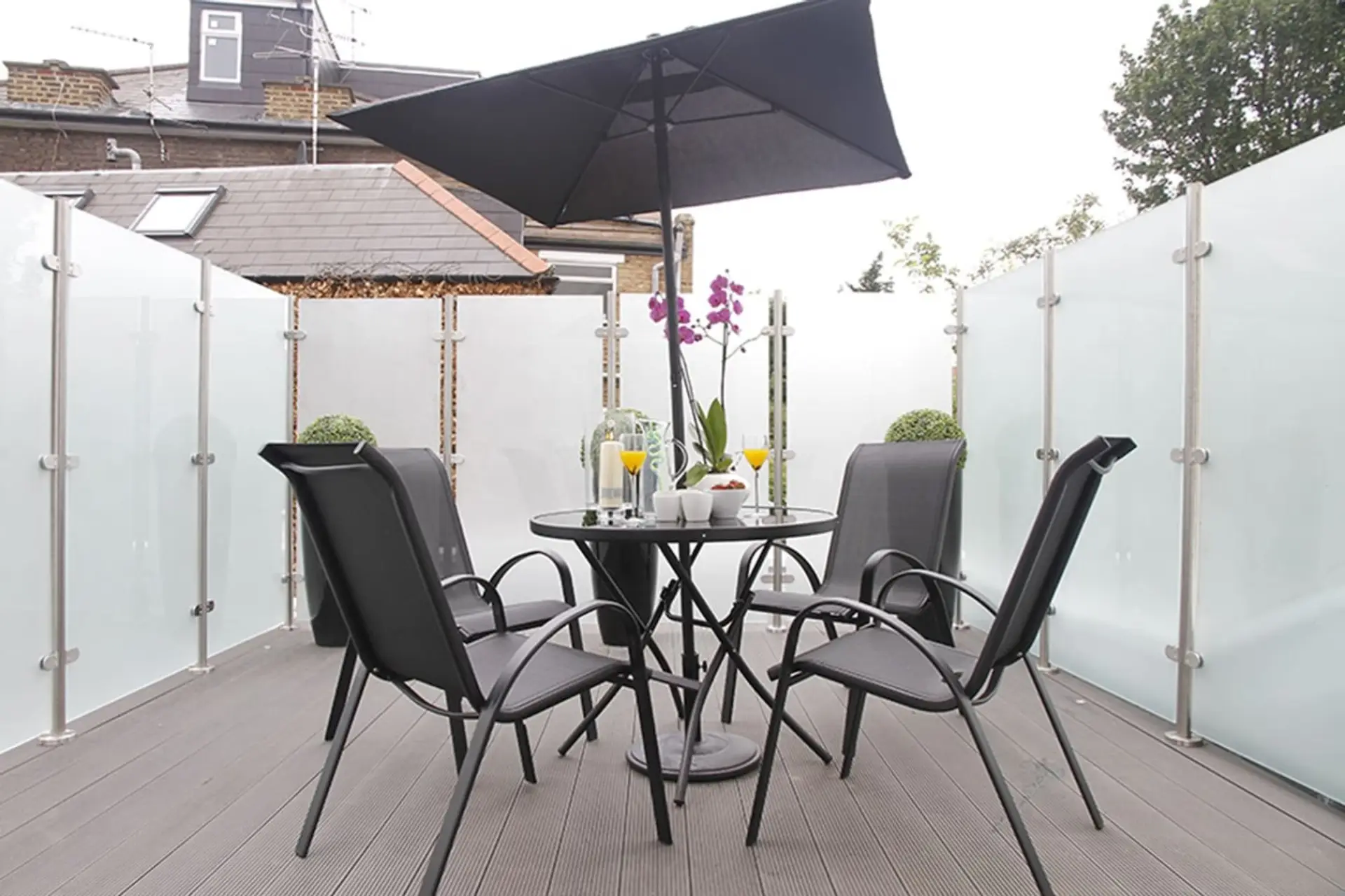 Private enclosed balcony with out door furniture