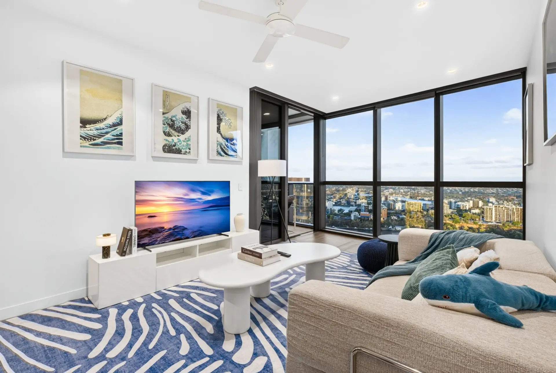 Living room with city and river views