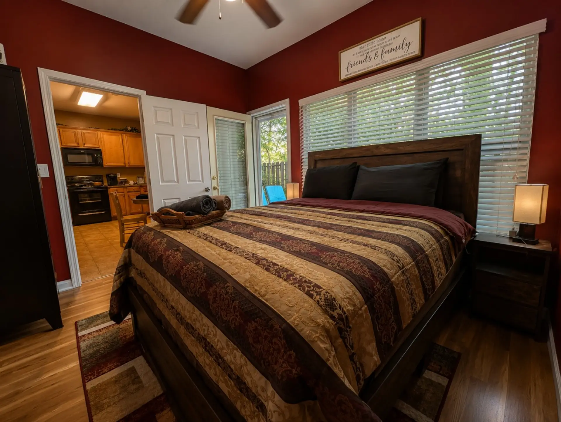 Lovely bedroom with 55-inch TV and direct patio access.