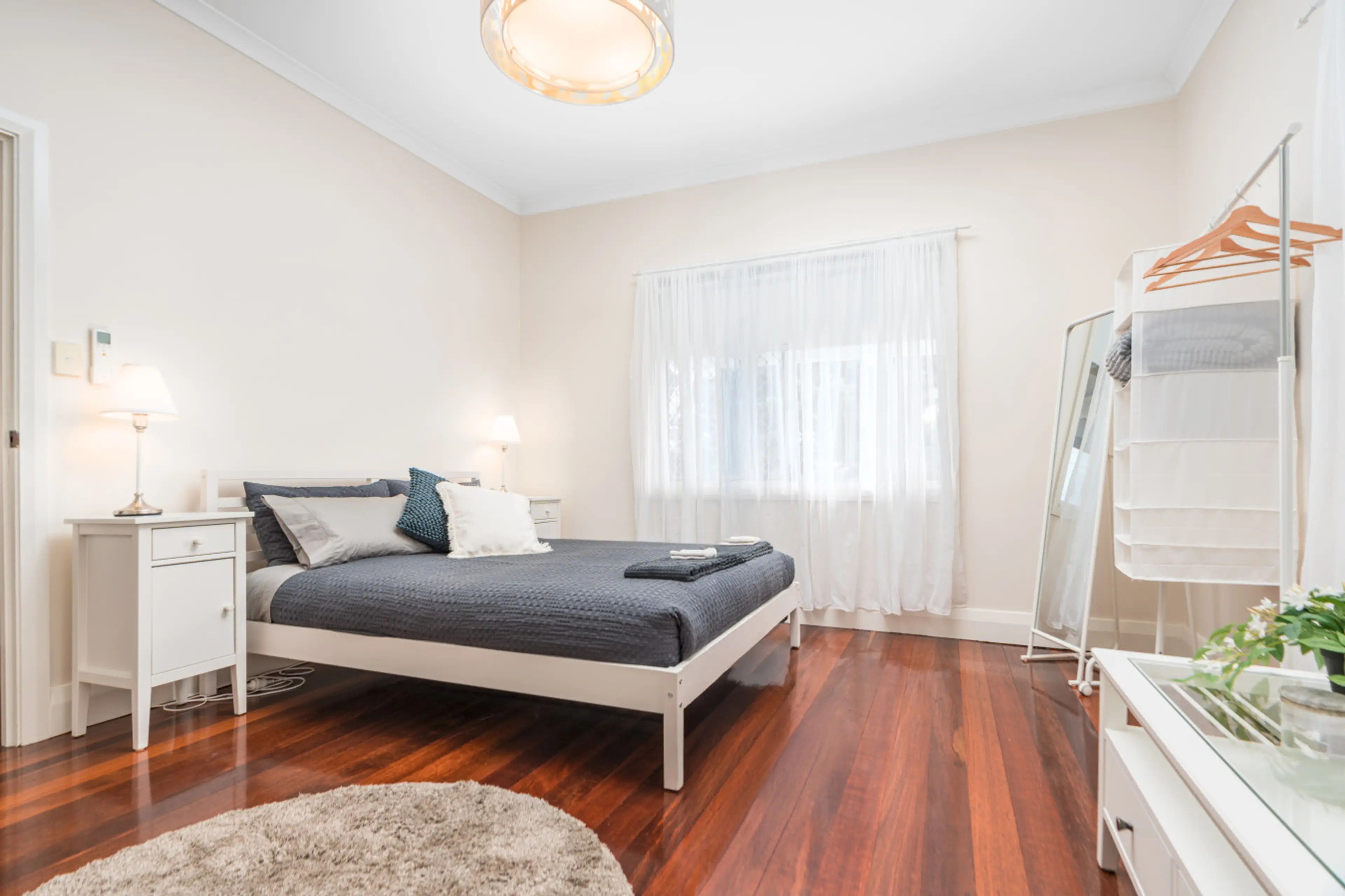 Peaceful main bedroom with queen bedding designed for laid-back coastal stays