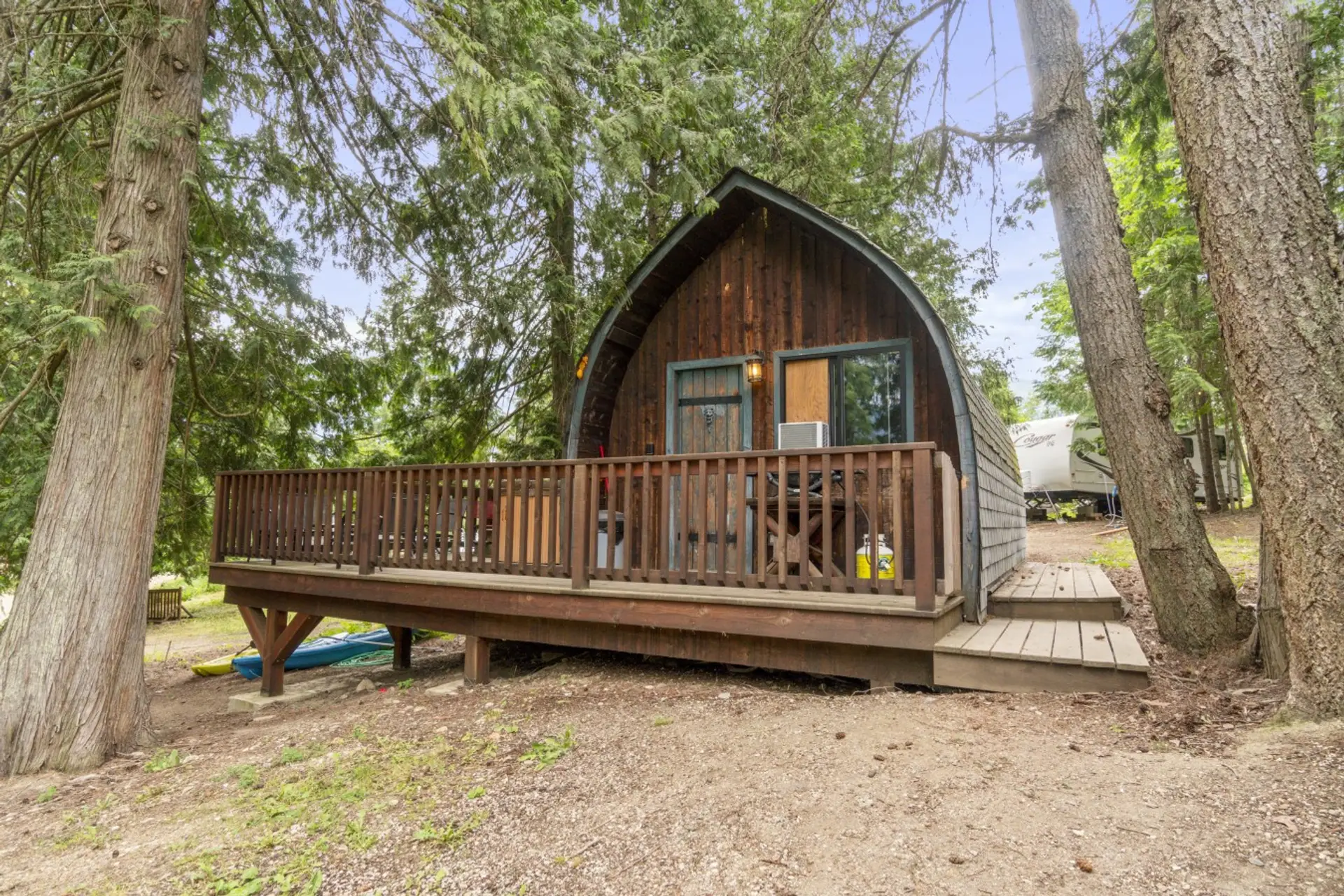 Charming A-frame cabin surrounded by peaceful forest views.