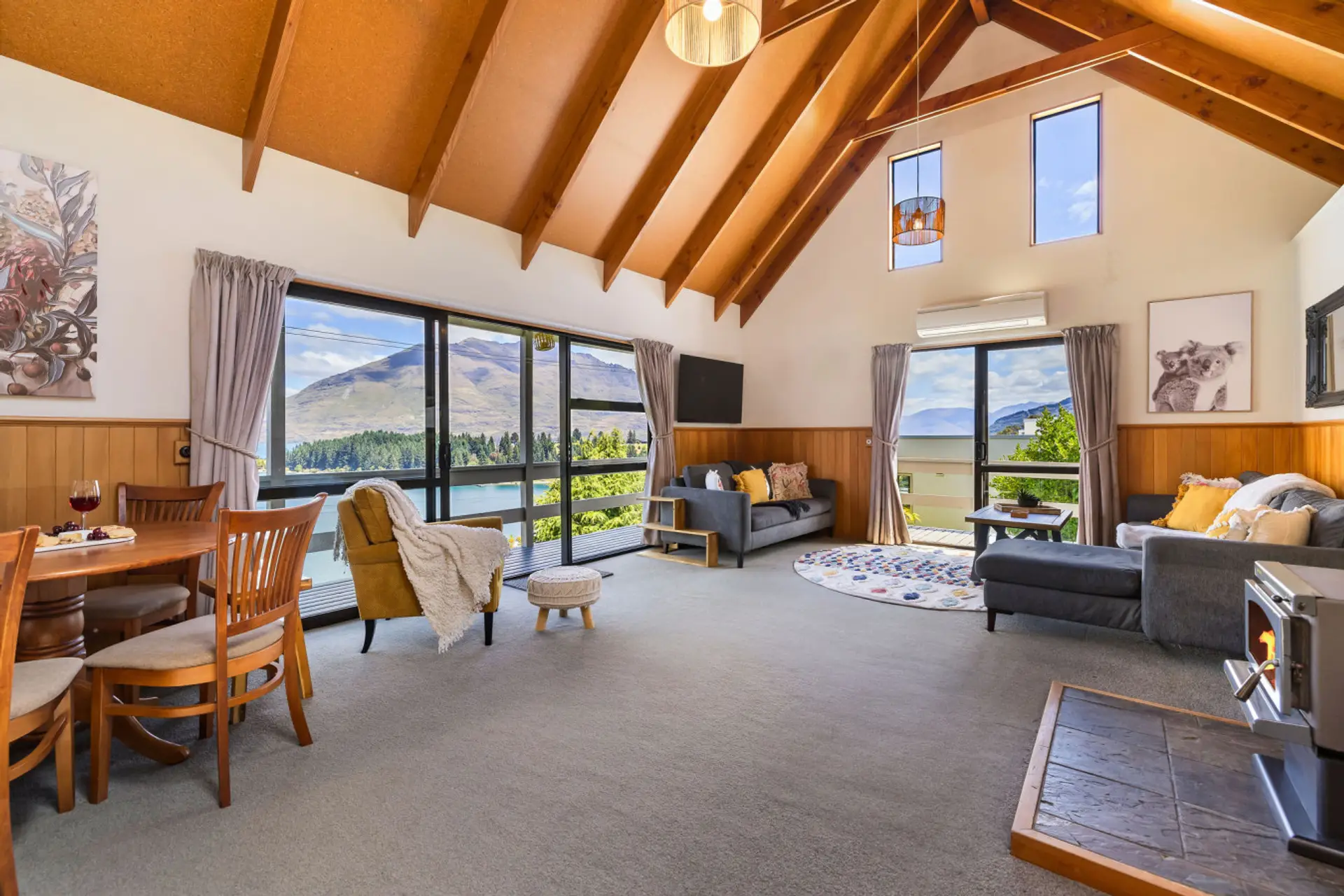 Open plan living area with fireplace and heat pump for cozy winter days