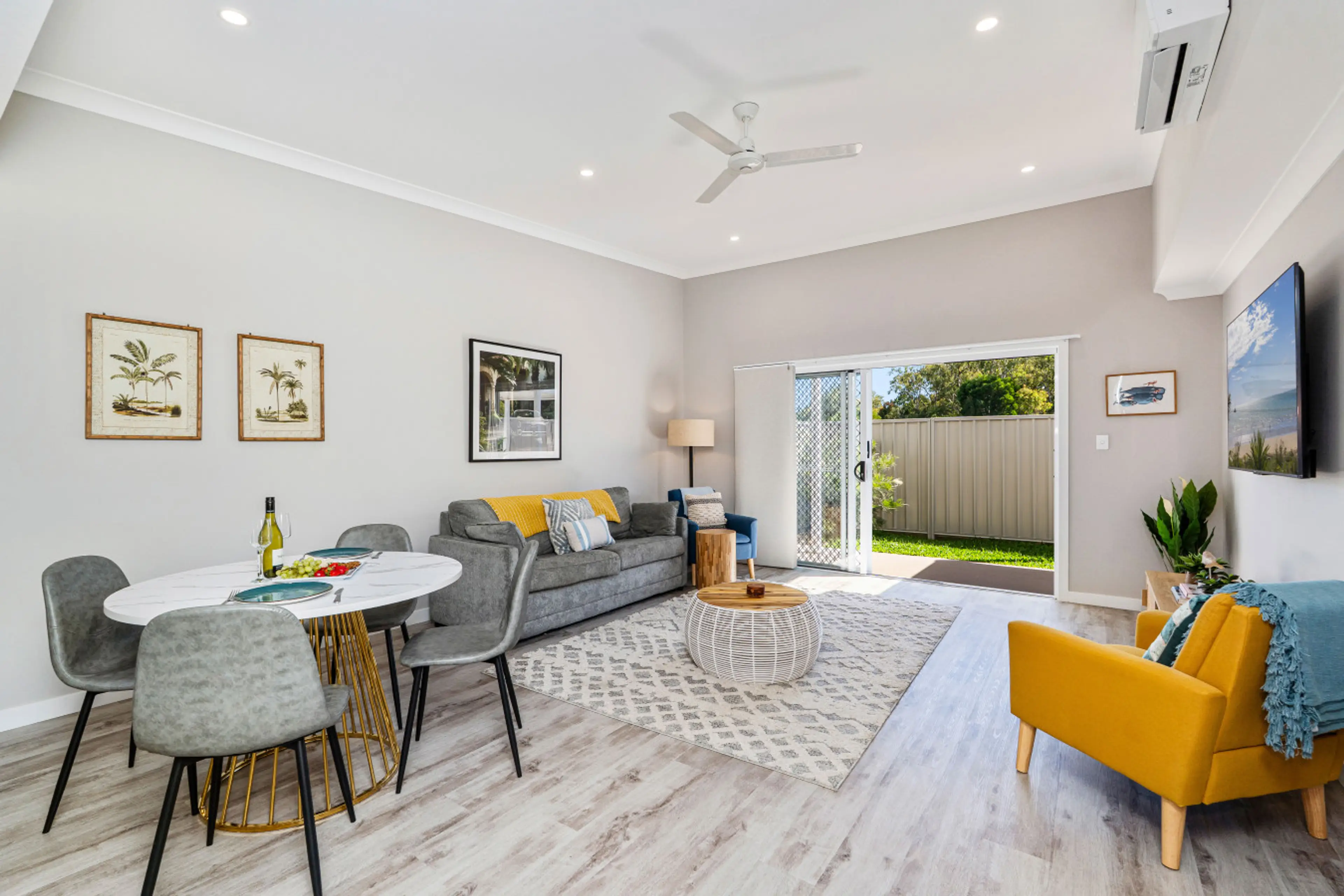 Enjoy the beautiful seamless indoor outdoor living. You can open the doors right up and keep the screen closed. Watch the kids play in the back yard while you relax on the couch.