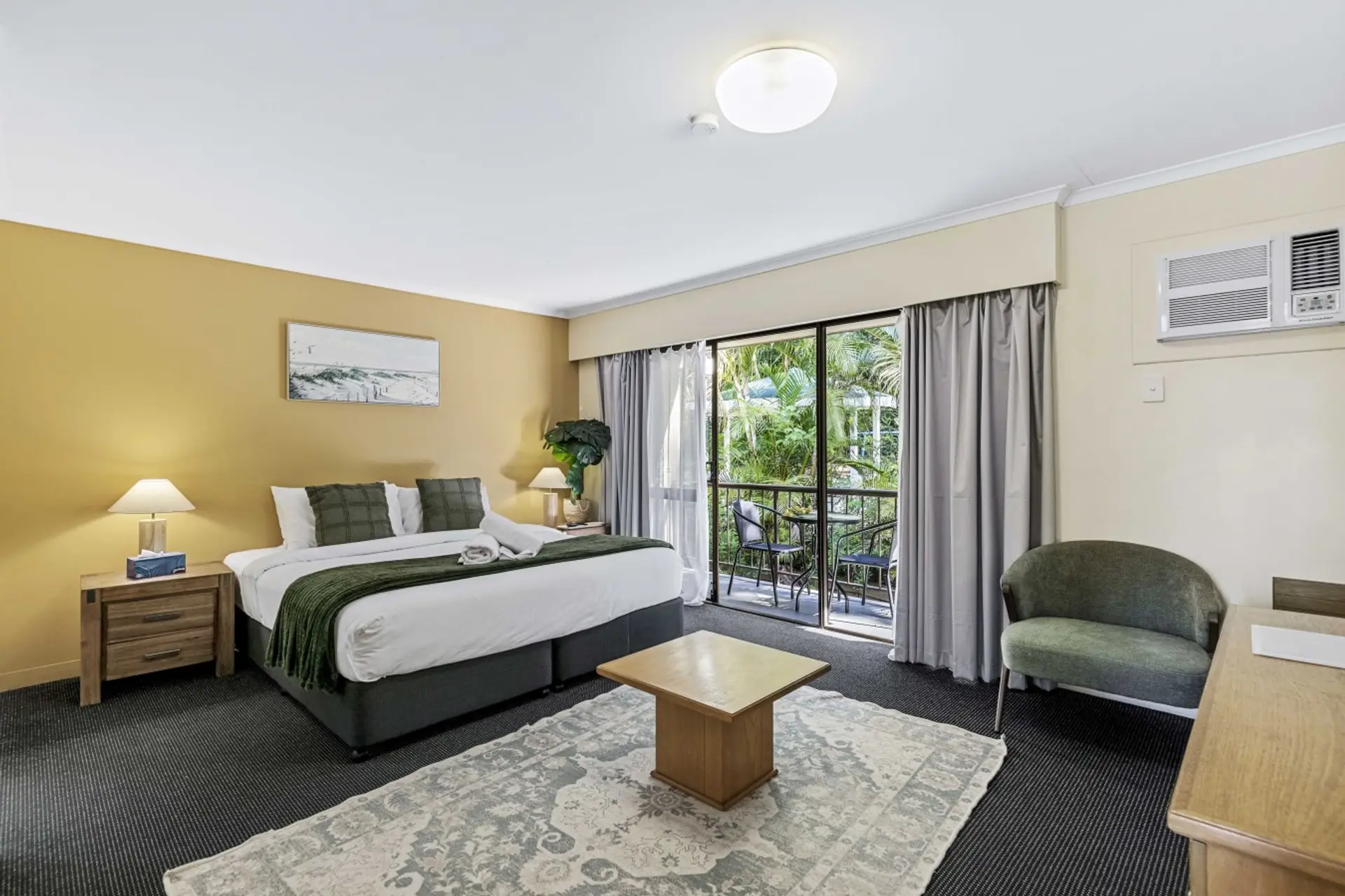 Unwind in a comfy king bed with tranquil leafy views