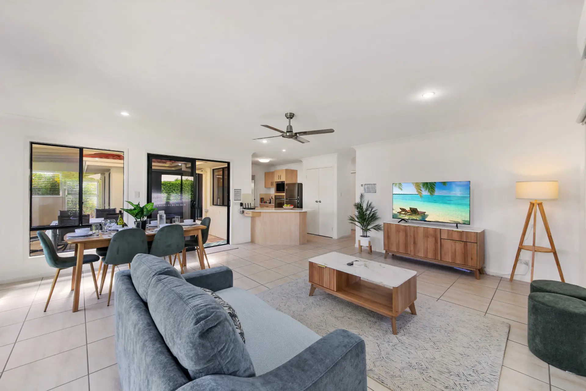Open plan living room with smart tv and air-conditioning.