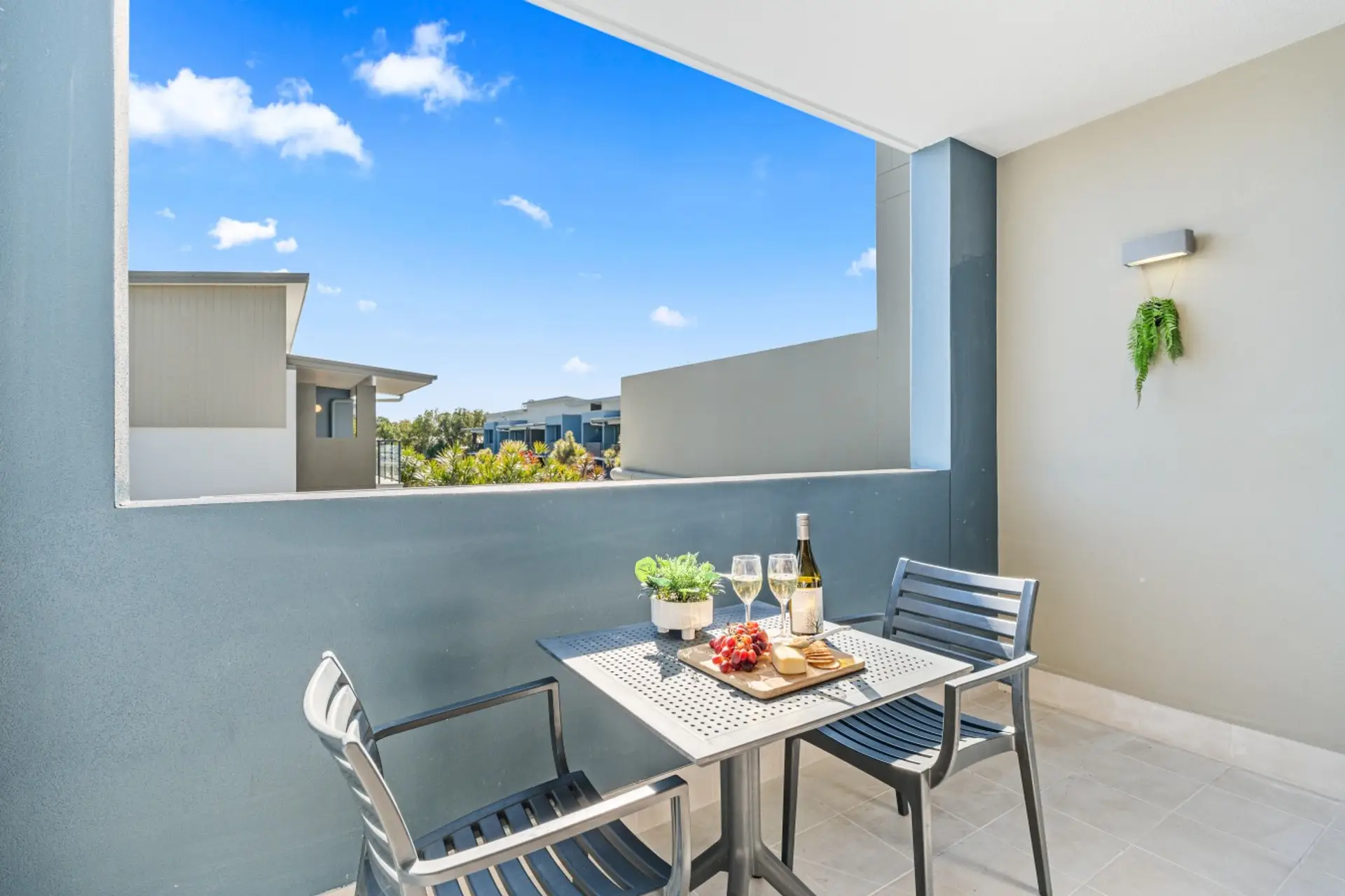 A sunny private balcony with outdoor dining for two — the perfect spot for a morning coffee or evening wine.