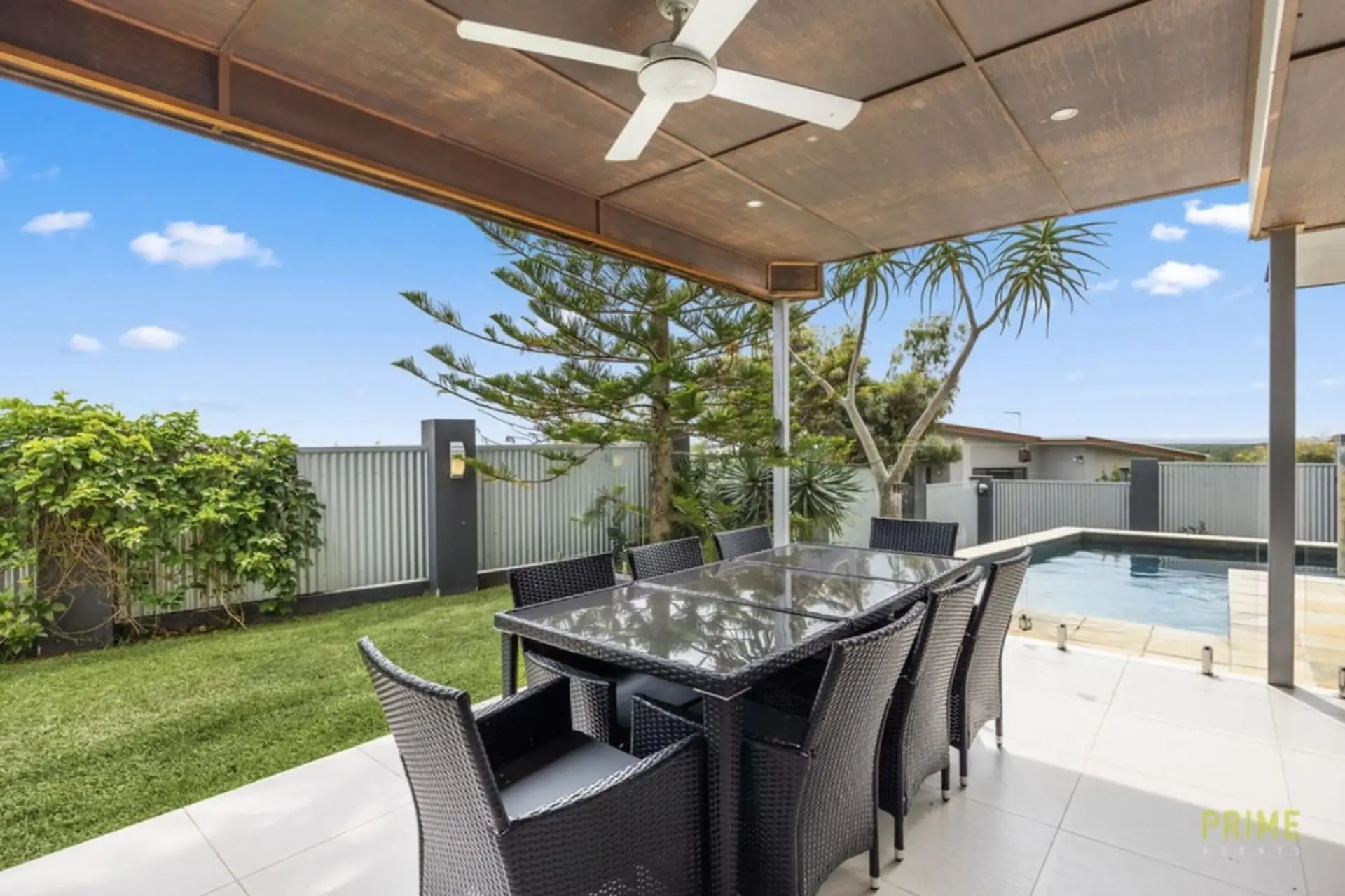 Al fresco dining for six under a covered patio, with the pool just steps away — made for long lunches and lazy afternoons.