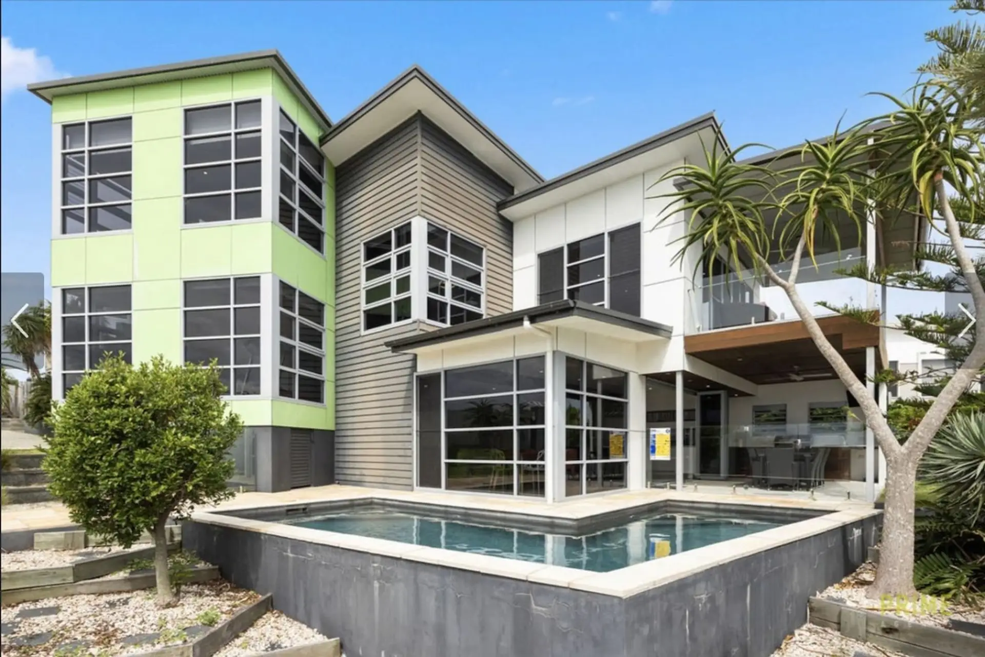 A striking contemporary home with a private pool, floor-to-ceiling windows, and serious street presence — welcome to your holiday base.