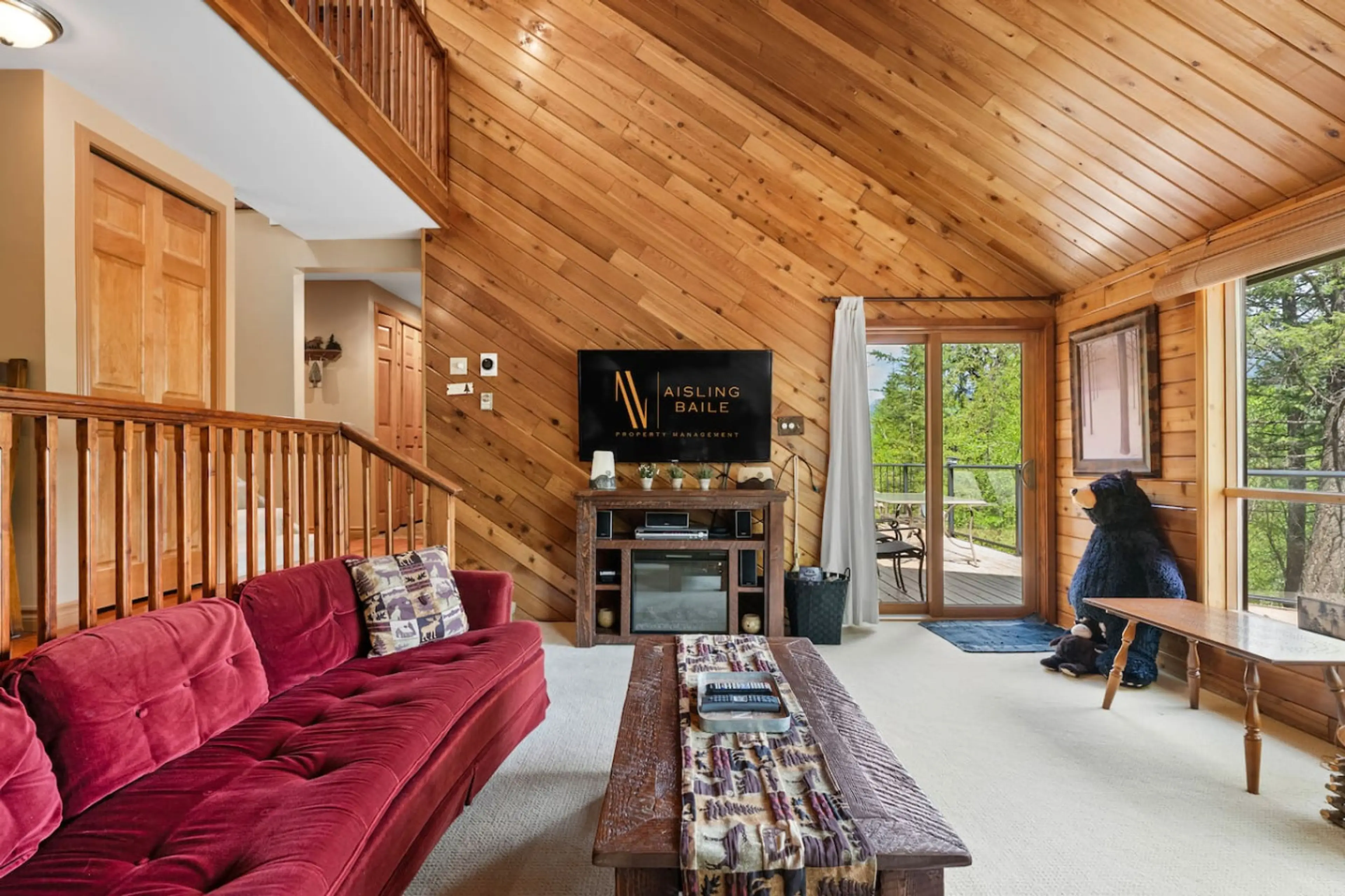 Living room with a 50" TV with cable & a DVD player, electric fireplace, and luxurious couches to kick back on after a day of adventures
