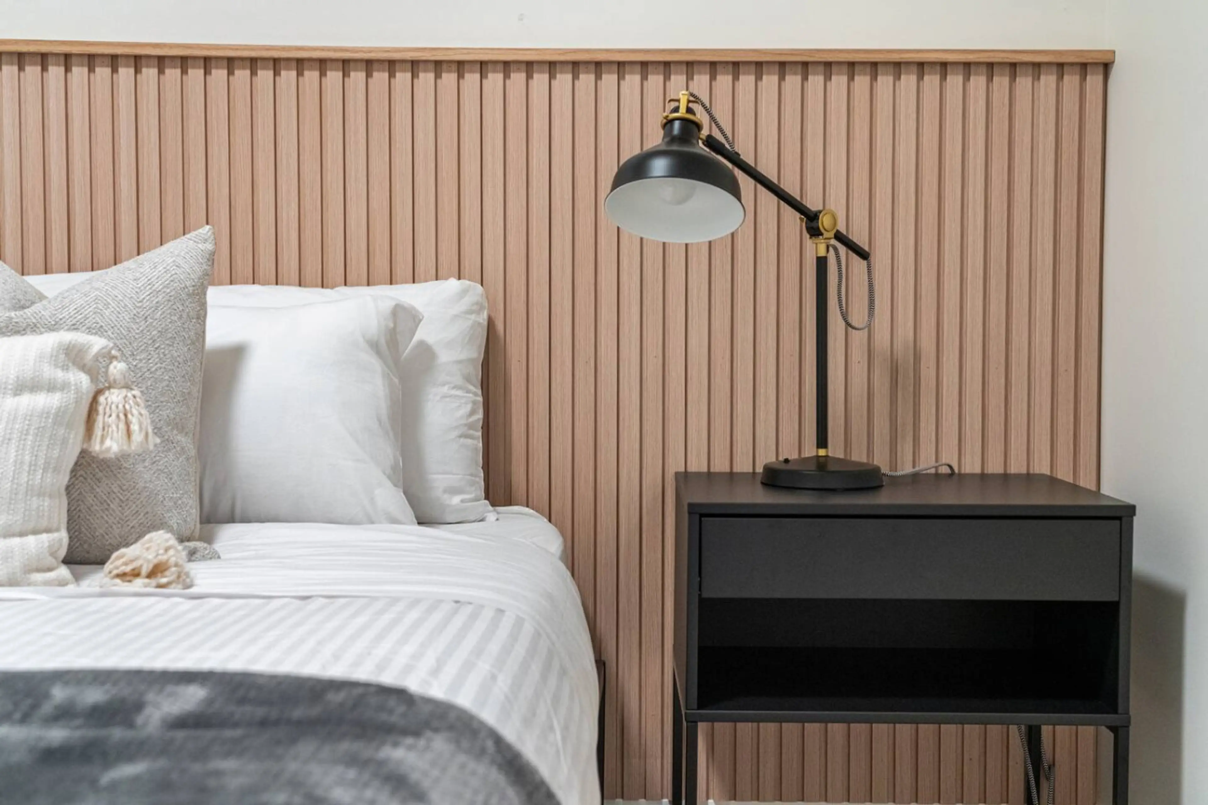 The bedroom features a queen bed, closet & room-darkening shades.