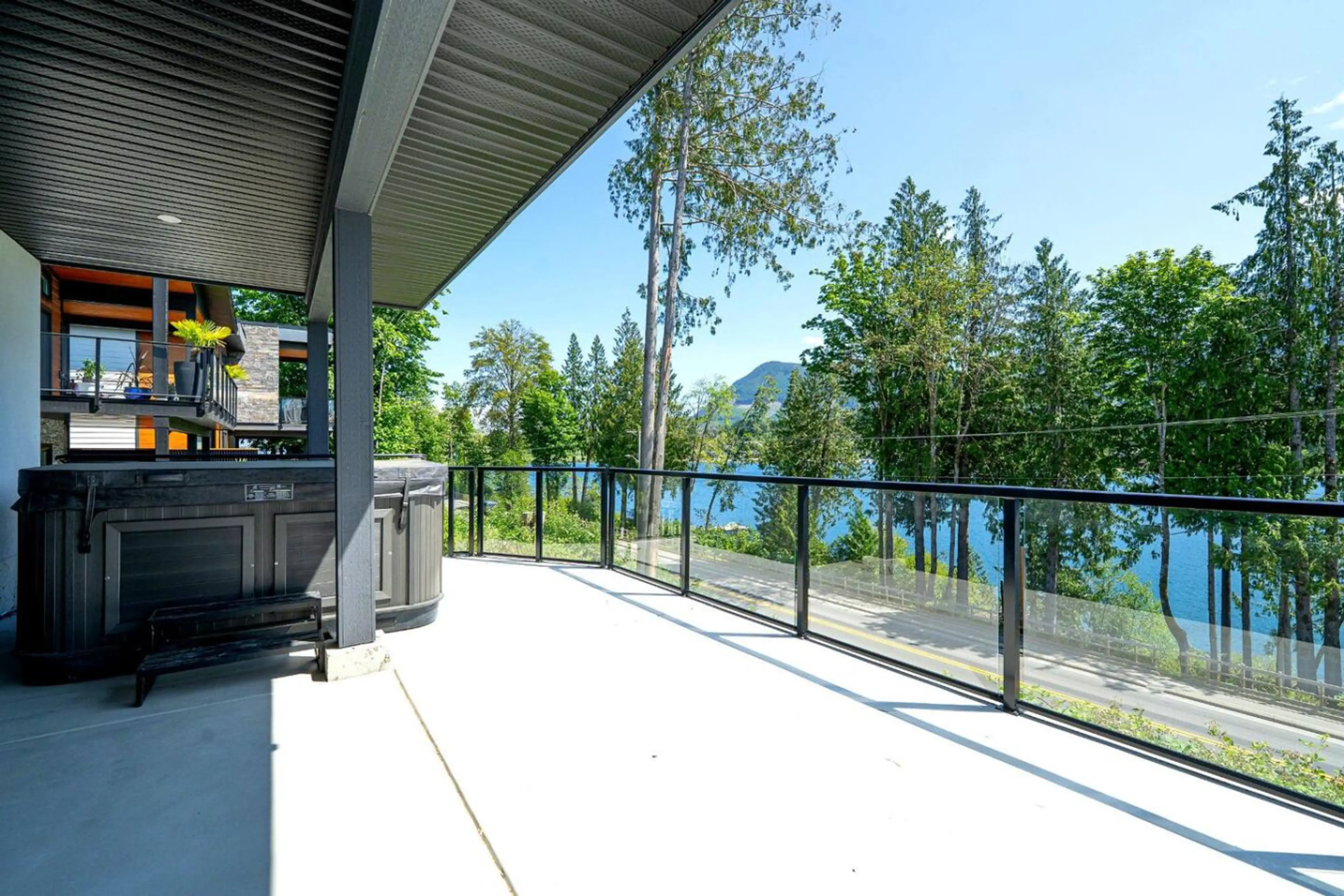 Saltwater hot tub with mountain & lake views. Please note that this is a shared amenity with the upstairs tenants (if present.)