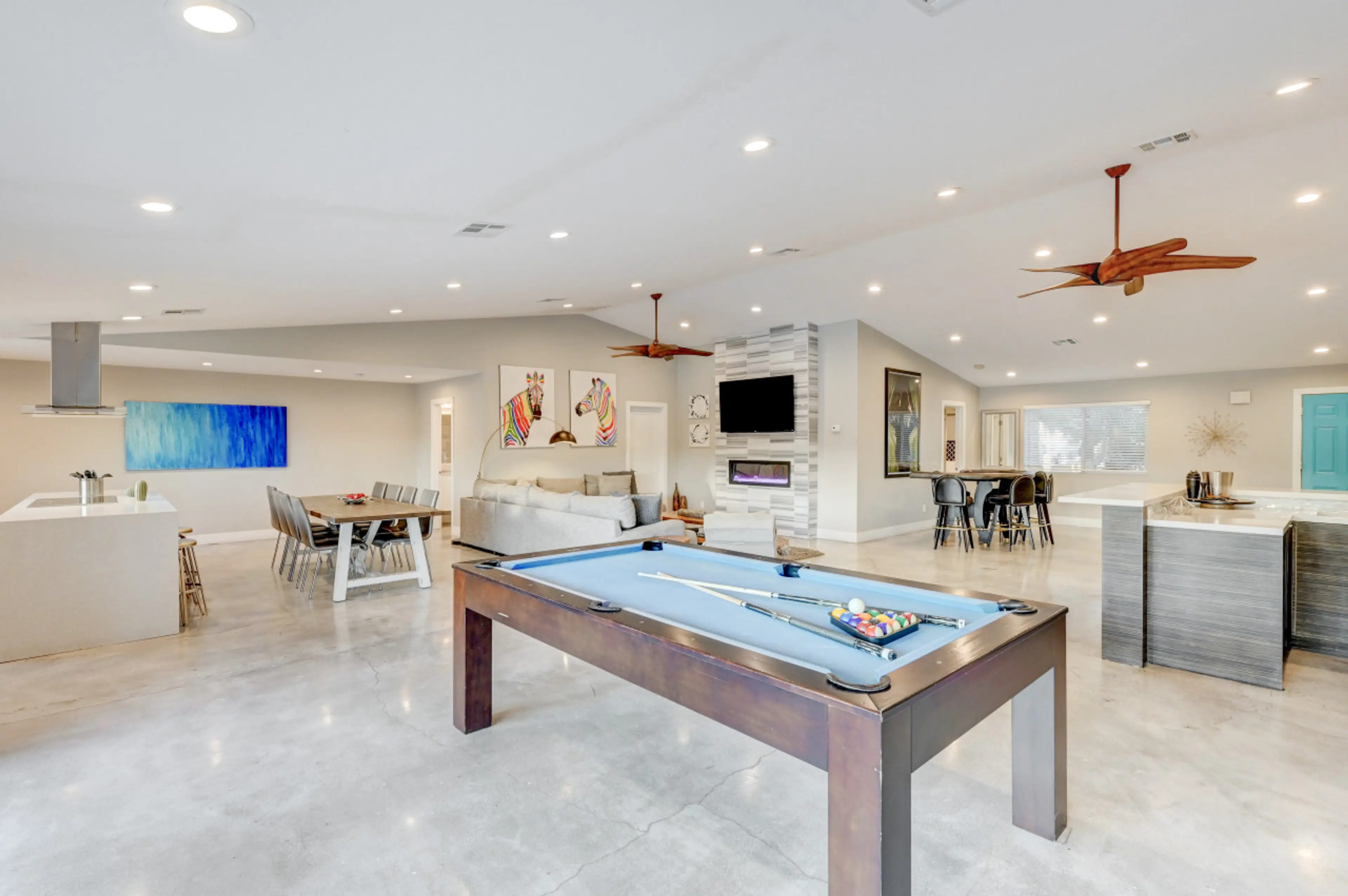 Open game room featuring pool table and expansive entertainment space