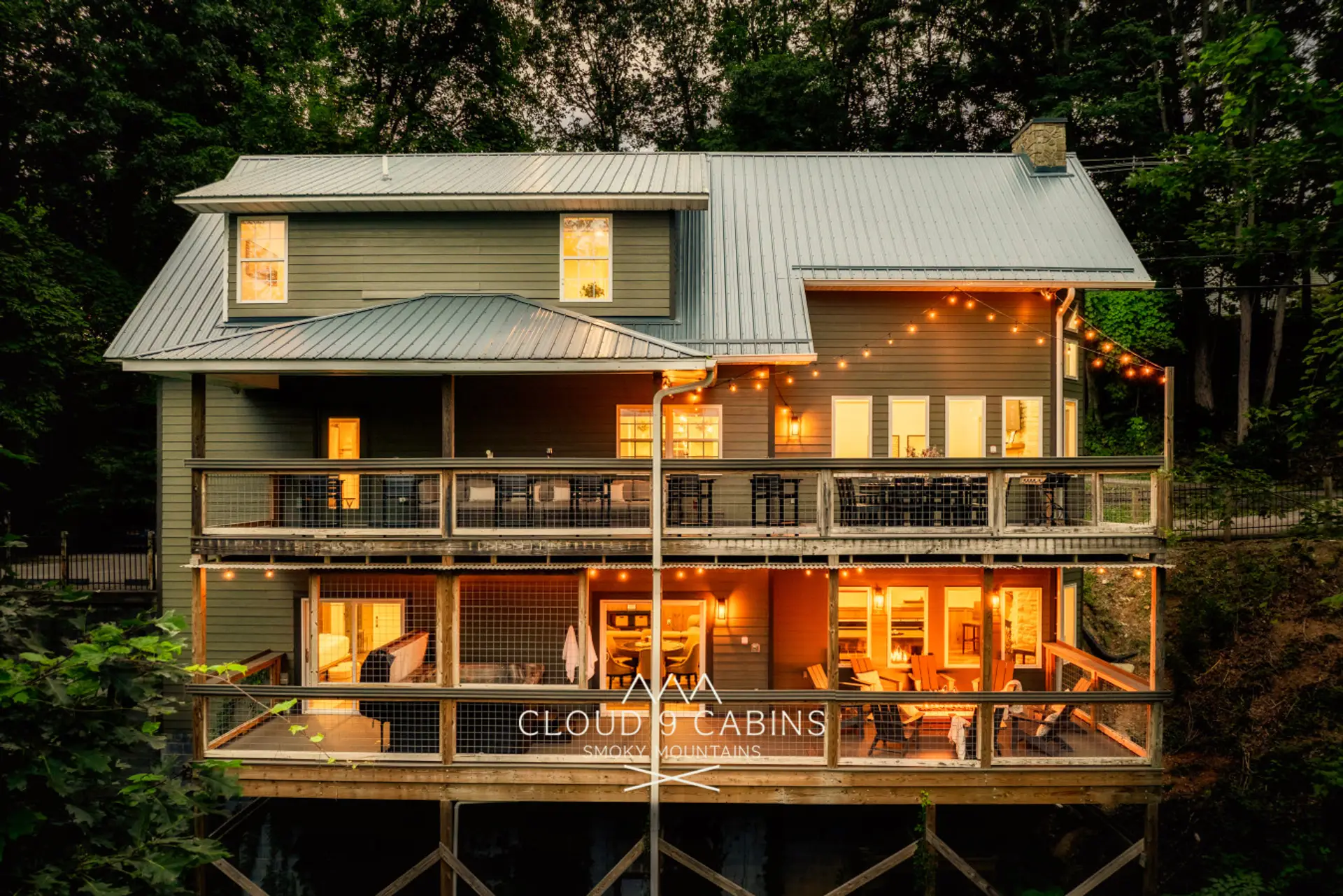 Back decks include a custom fire pit, hot tub, outdoor dining and plenty of comfortable seating!