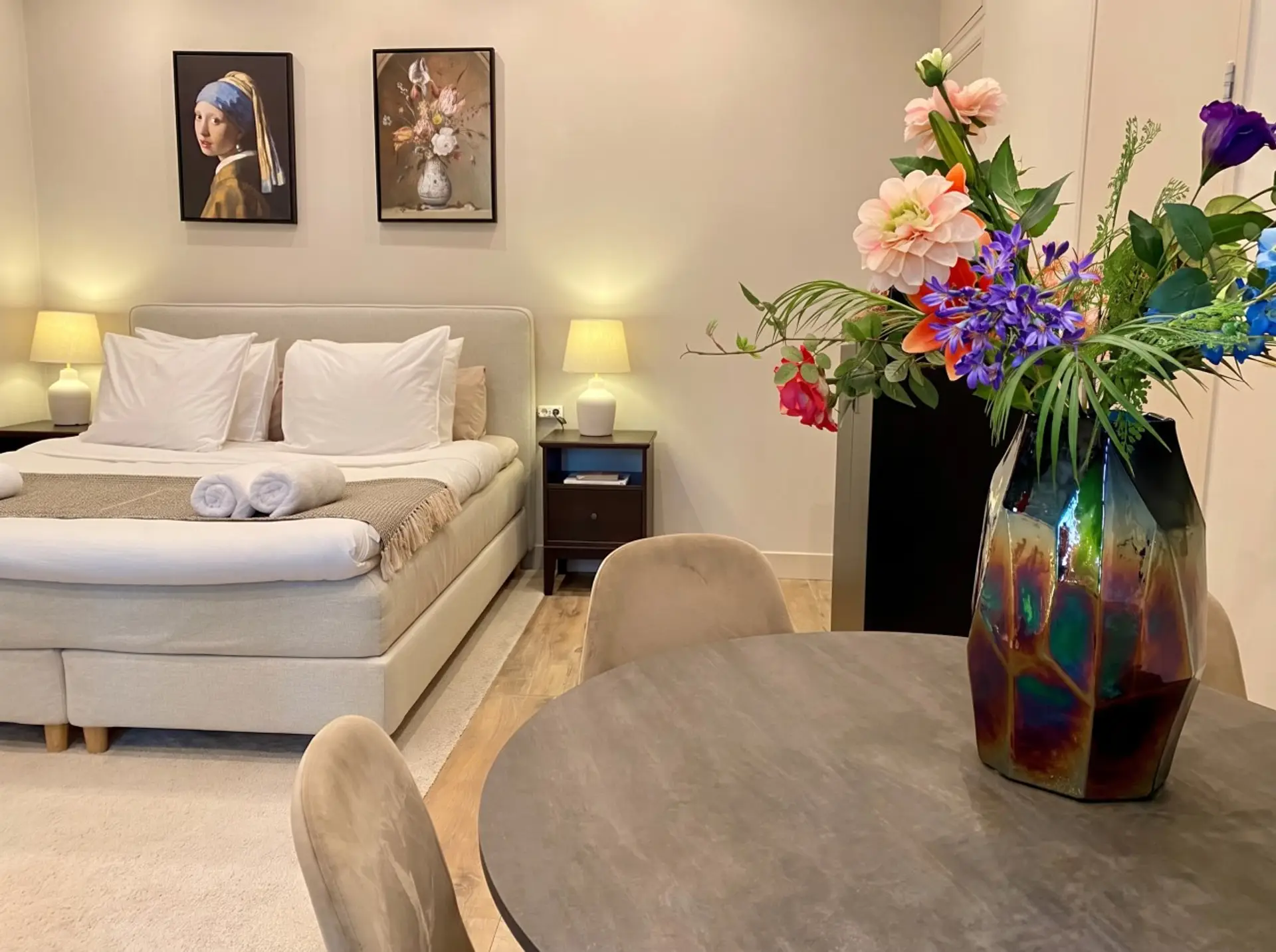 Plush king bed and classic dutch art