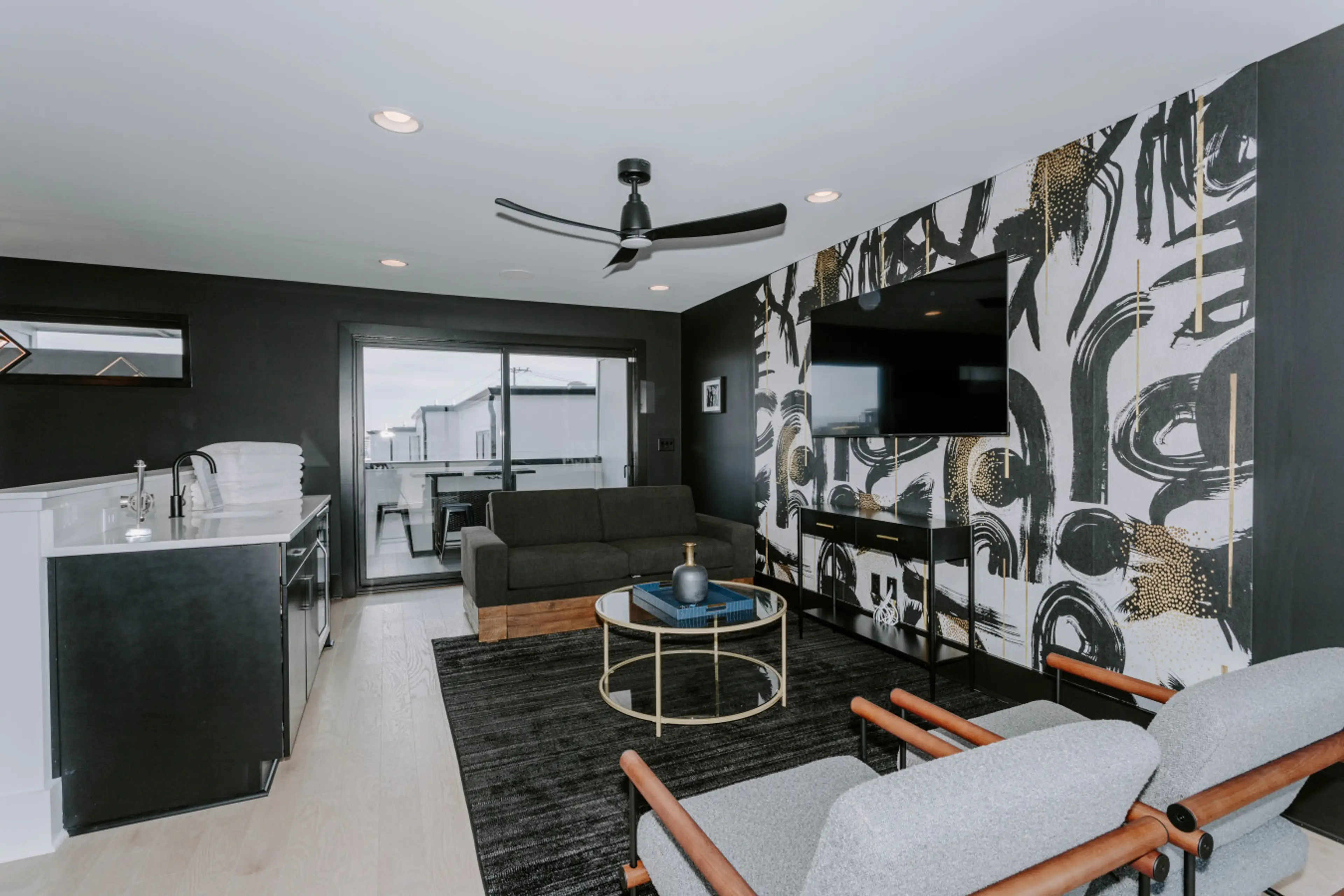 Designer wallpaper and finishes for you and your guests. The perfect upstairs lounge space set between two private patios!!!