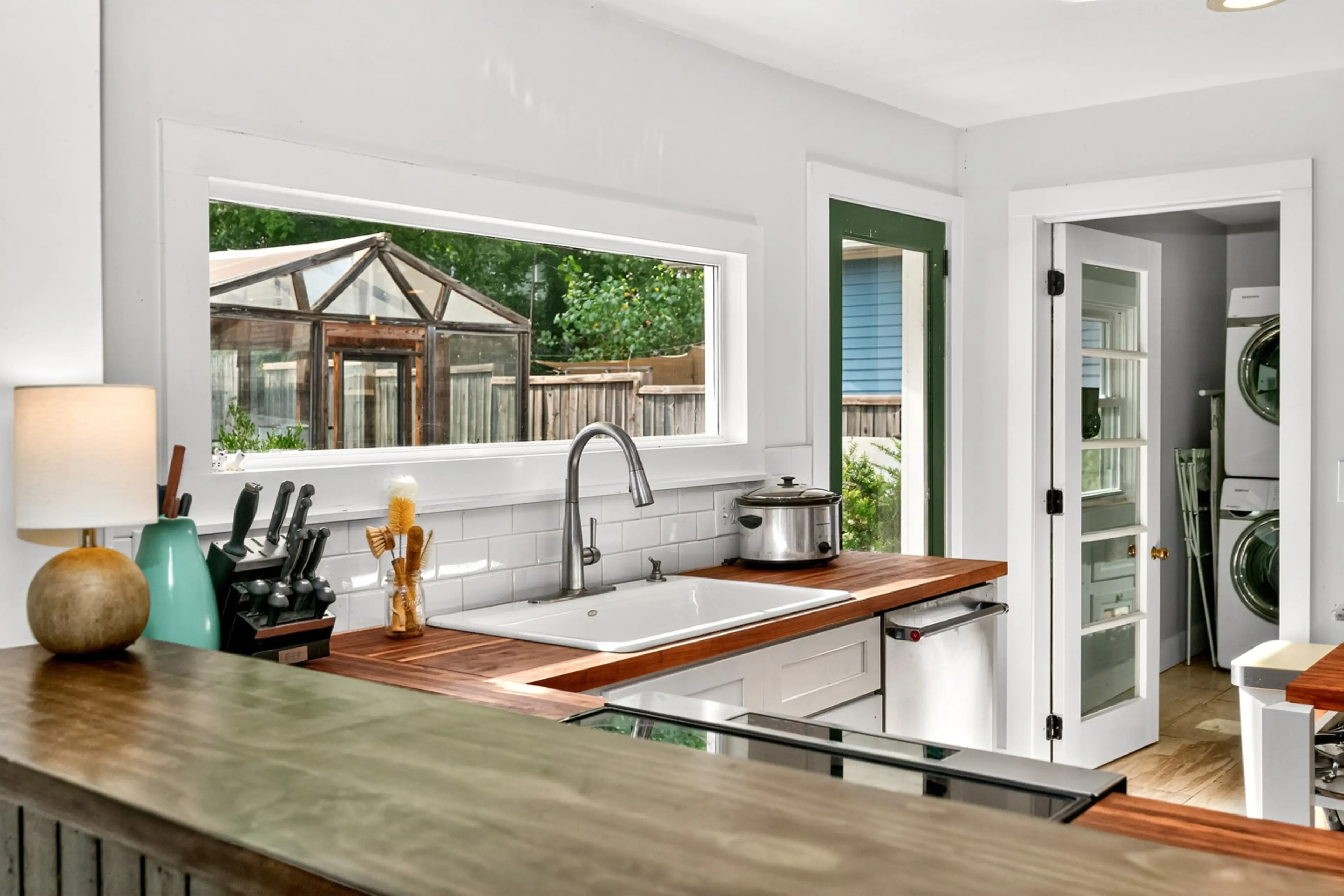 Bright kitchen with greenhouse view – perfect for your Nashville stay!